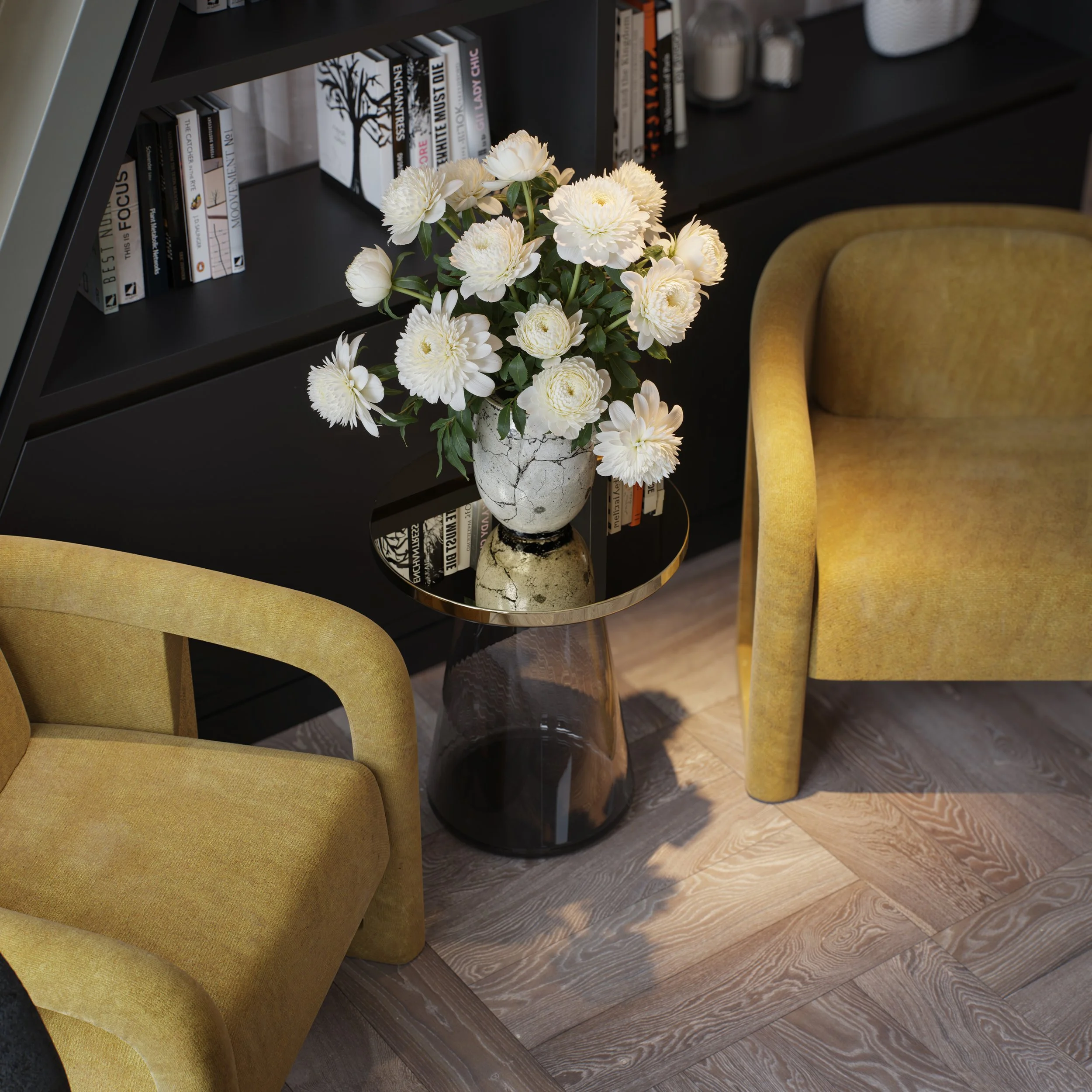 A black bookshelf with books, a vase of white flowers on a side table, two mustard yellow armchairs, and a hardwood floor.