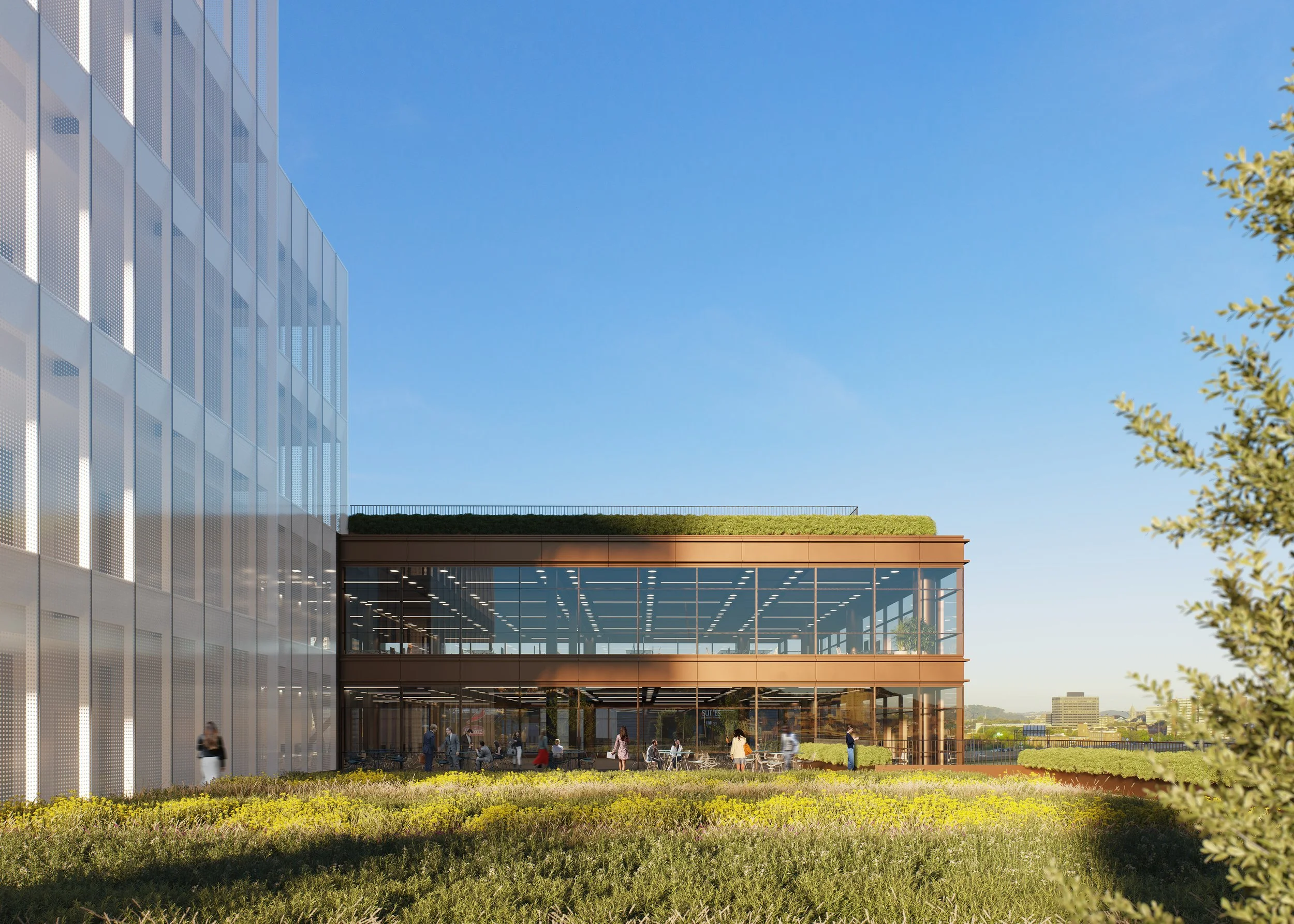 Modern building with glass facade and outdoor terrace, surrounded by greenery and people walking.