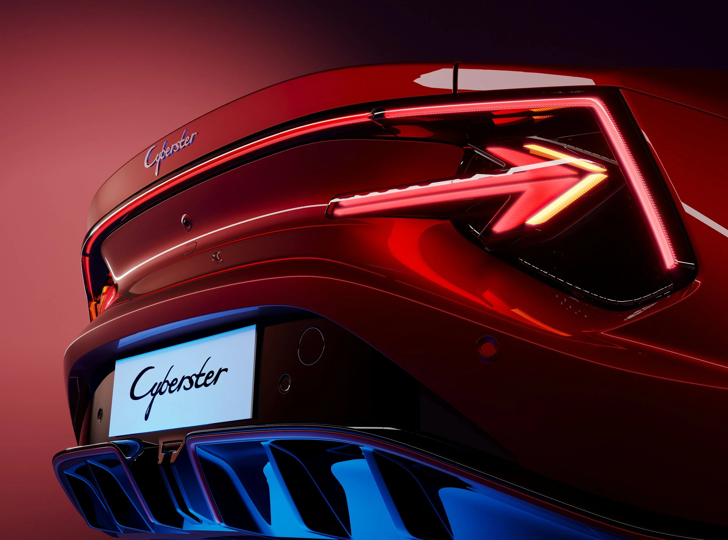 Close-up of a futuristic red sports car with illuminated taillights and a rear diffuser, displaying the word 'Cyberster' on a license plate and on the car body.