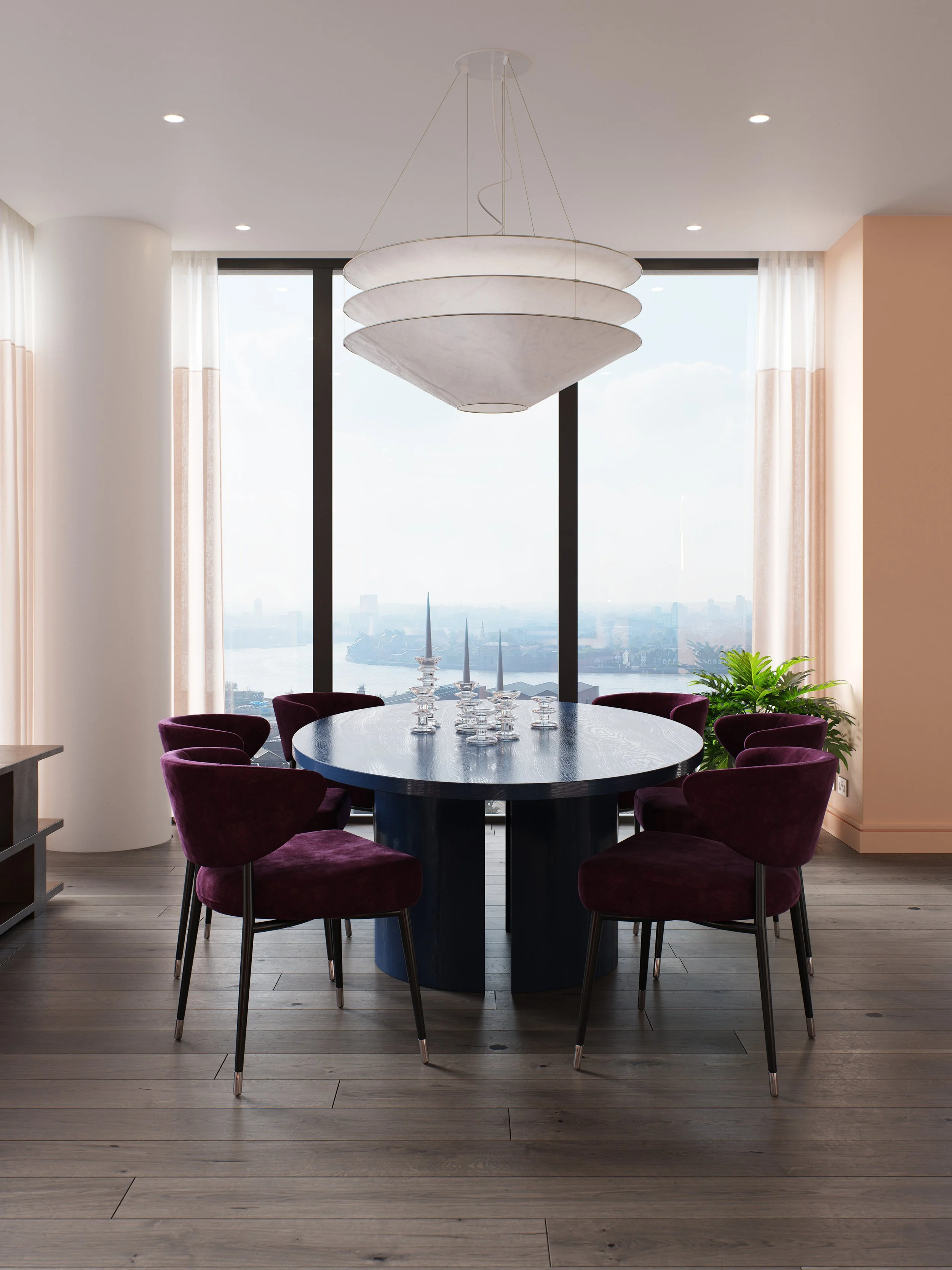 Modern dining room with a round black table, six purple velvet chairs, large window with city view, and a white hanging light fixture.
