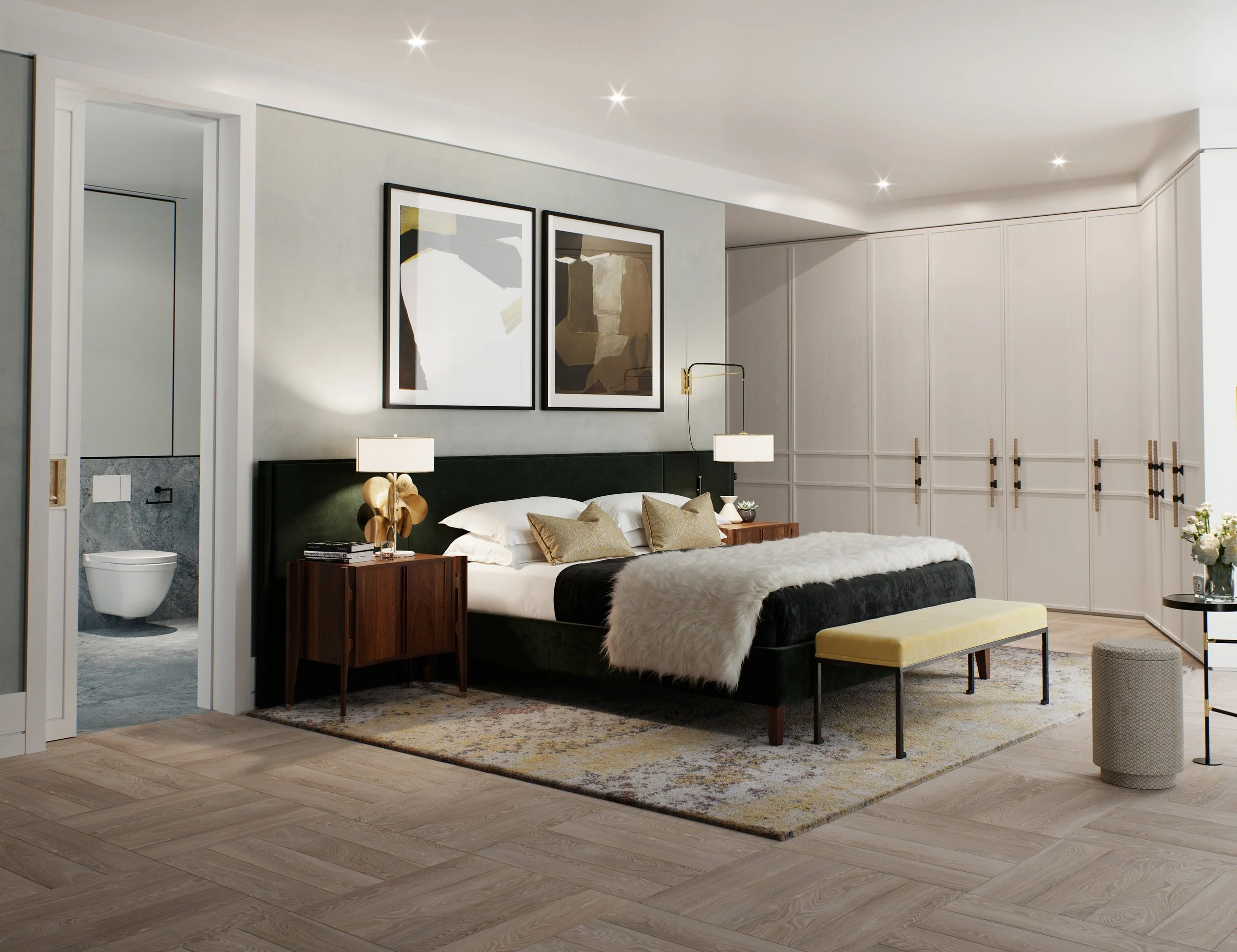 A modern bedroom with a king-sized bed, nightstands with lamps, artwork above the headboard, a sitting bench at the foot of the bed, a large built-in closet, and an adjacent bathroom with a toilet visible through an open door.
