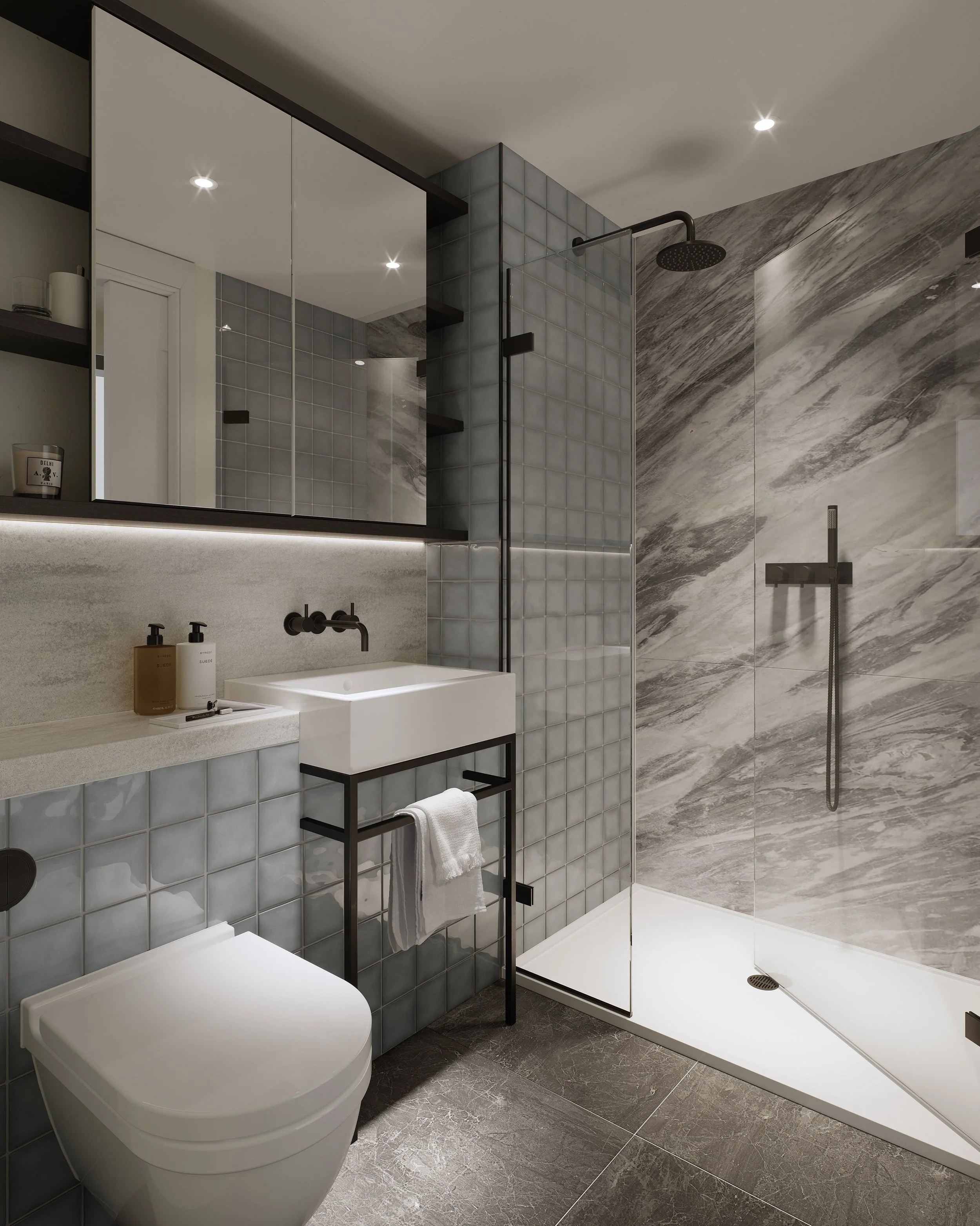 Modern bathroom with a walk-in shower, gray tiled walls, a white sink with a black metal stand, and a wall-mounted toilet.
