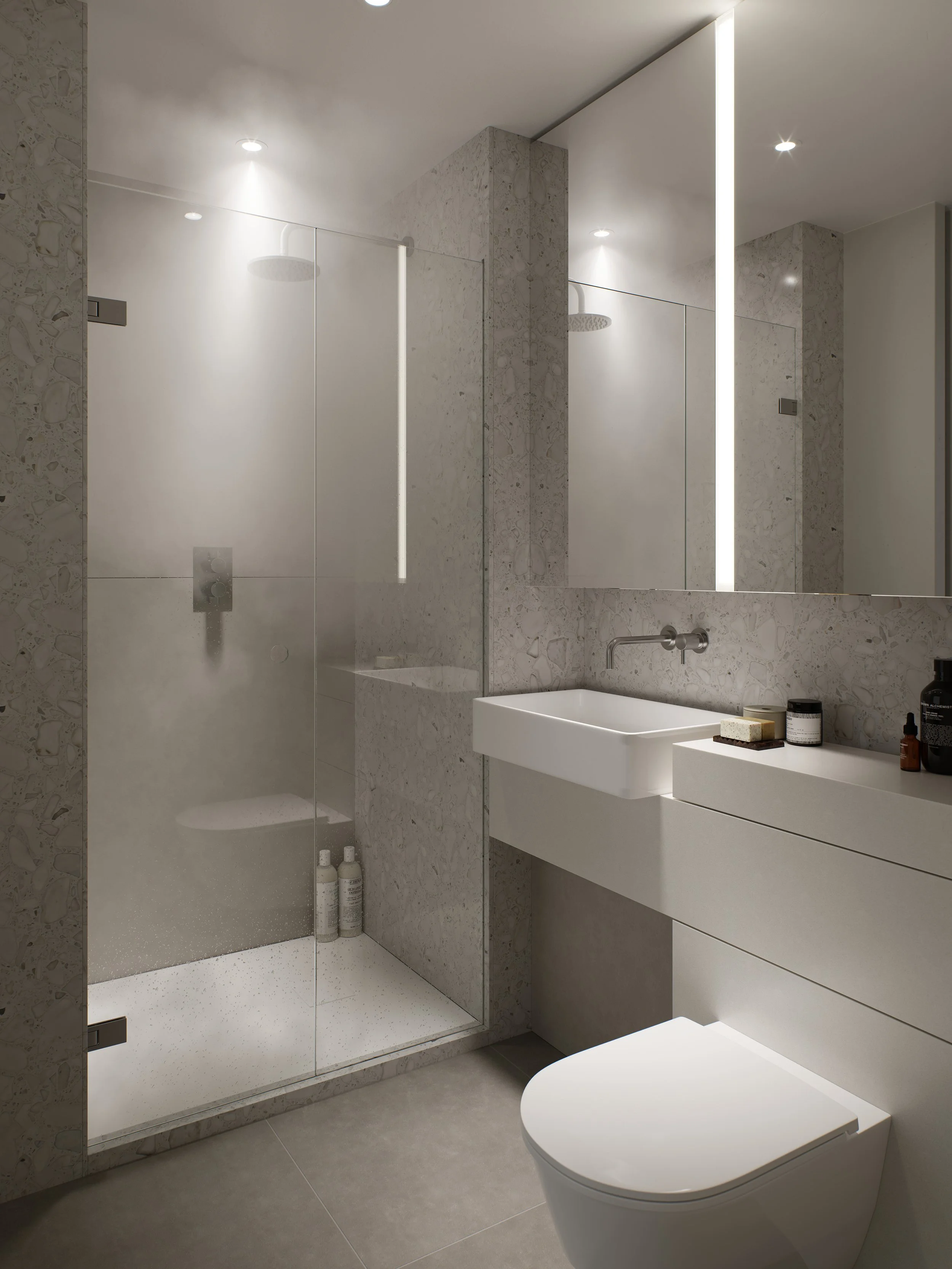 Modern bathroom with a walk-in shower enclosed by glass, a white wall-mounted sink, and a white toilet with a minimalist design. The bathroom features neutral tones, marble walls, a large mirror, and recessed ceiling lights.