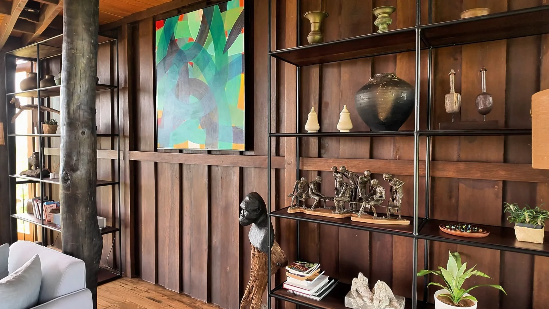 sri lankan art and book shelves in the lounge of trebartha east