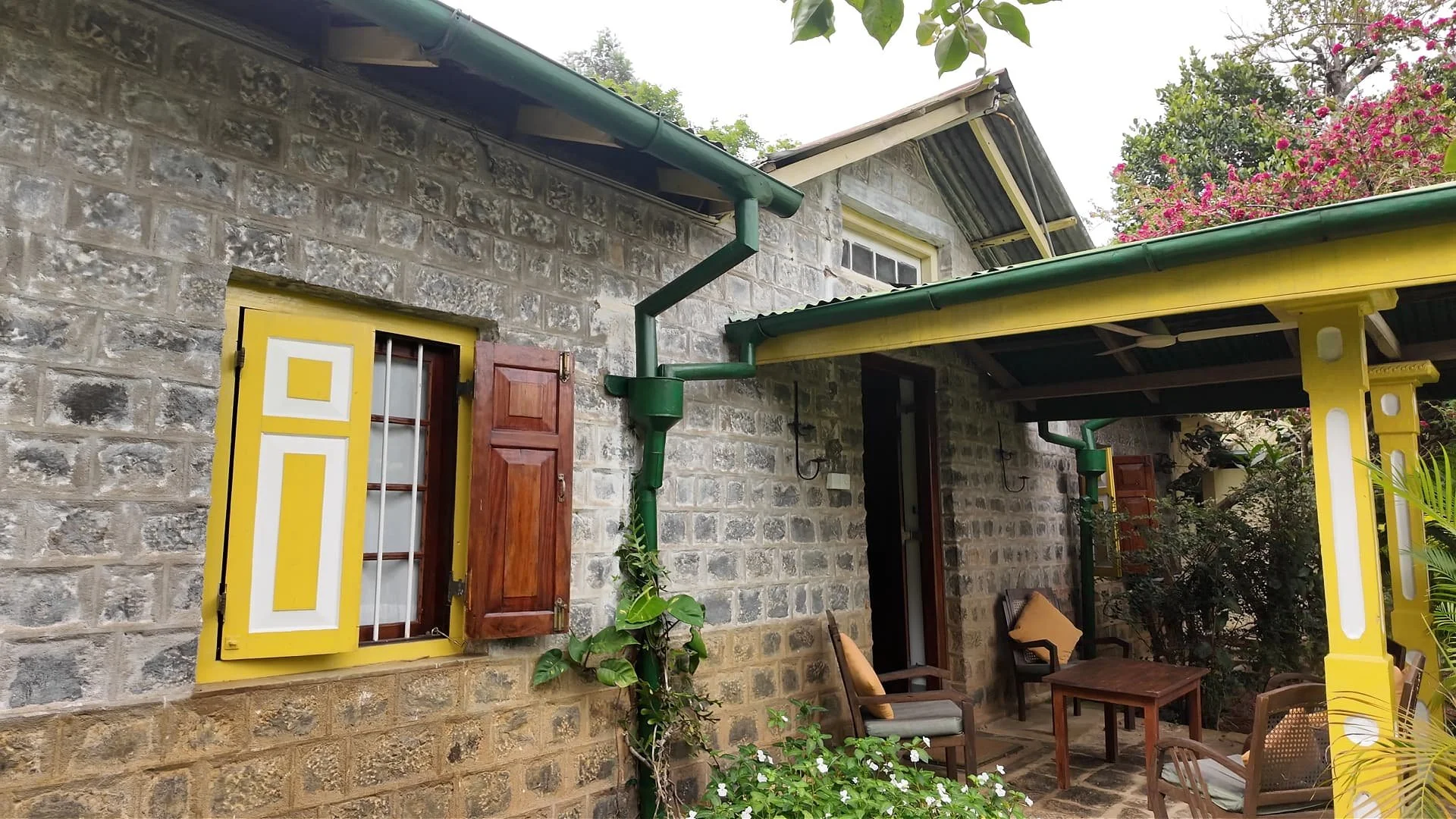 a century old farmhouse that is still in use as a holiday accommodation at amba estate, an organic farm and social enterprise in the hill country of sri lanka