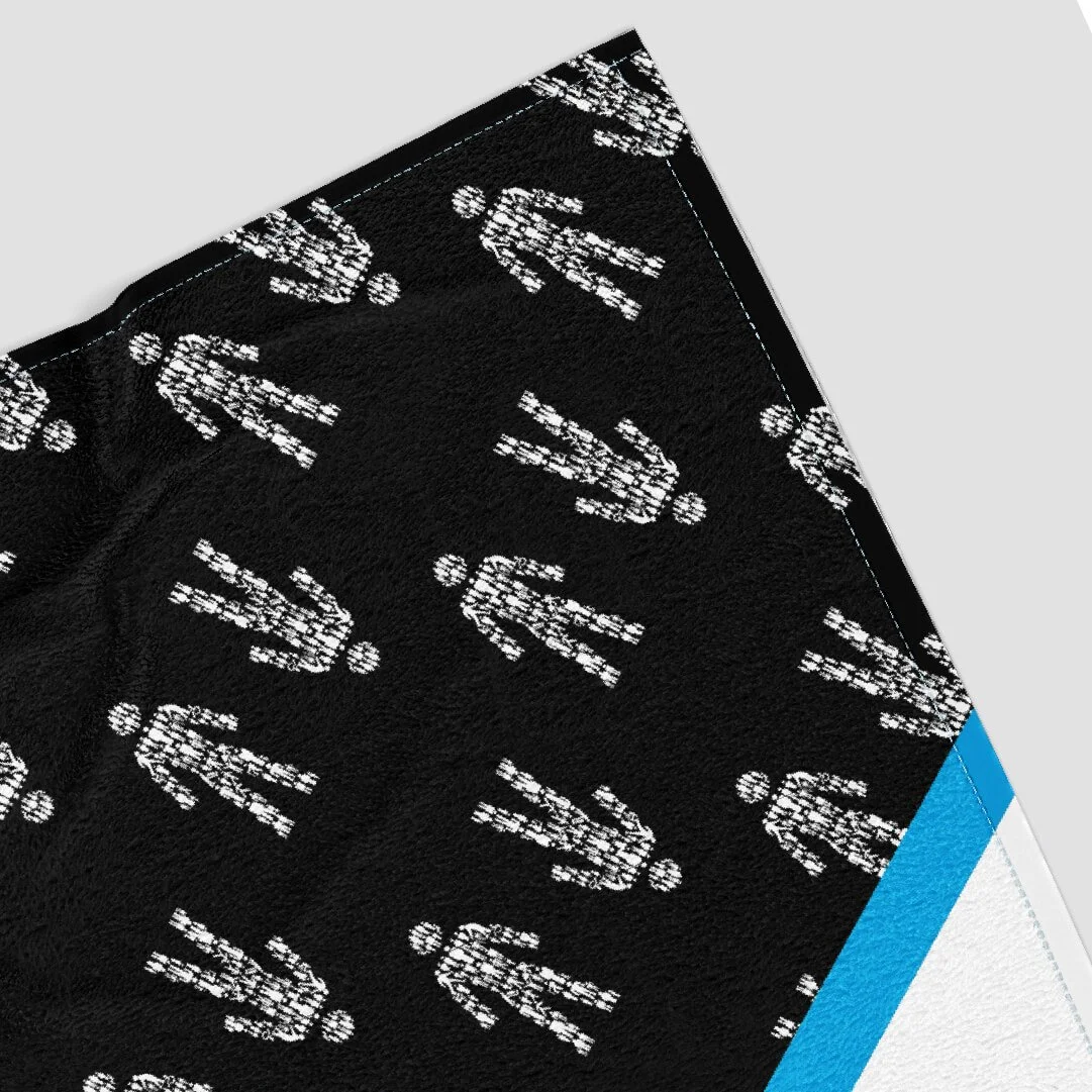 Close-up of a black fabric with repeating white stick-figure style human icons.