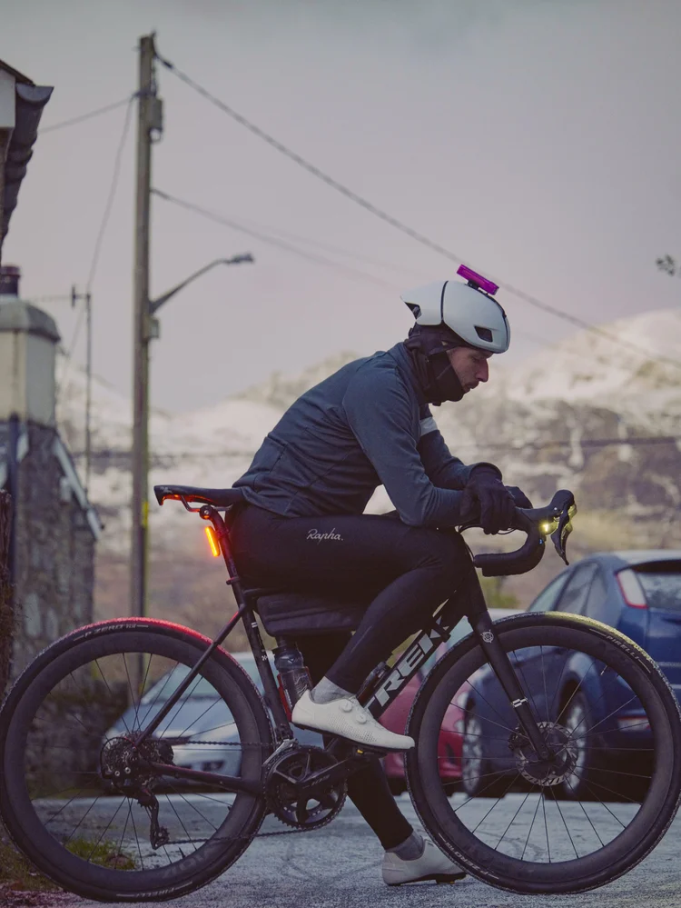 Daniil setting off from the village with his bike lights on