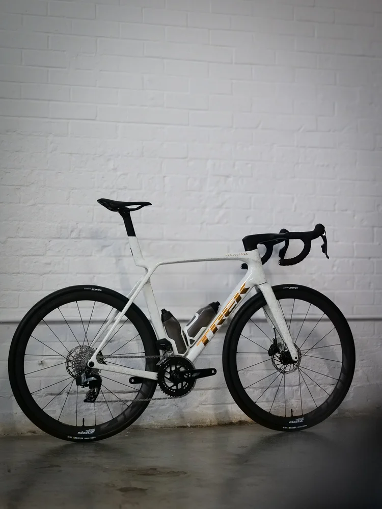 A white Trek Madone on the polished floor of the show