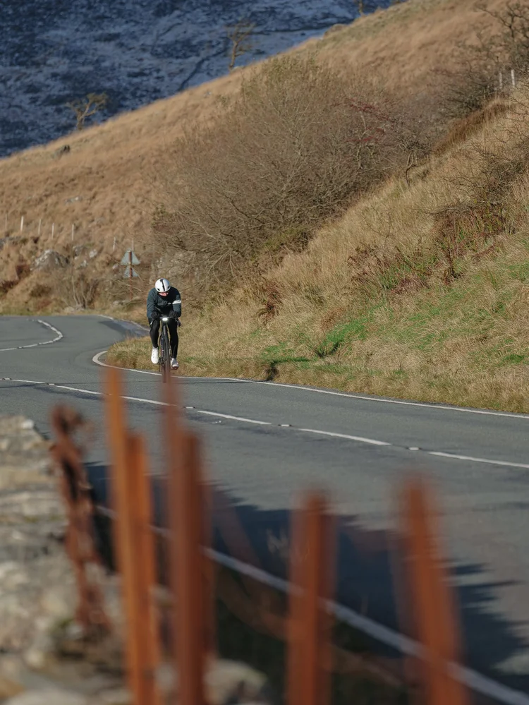 Daniil climbing a winding road through autumn hills