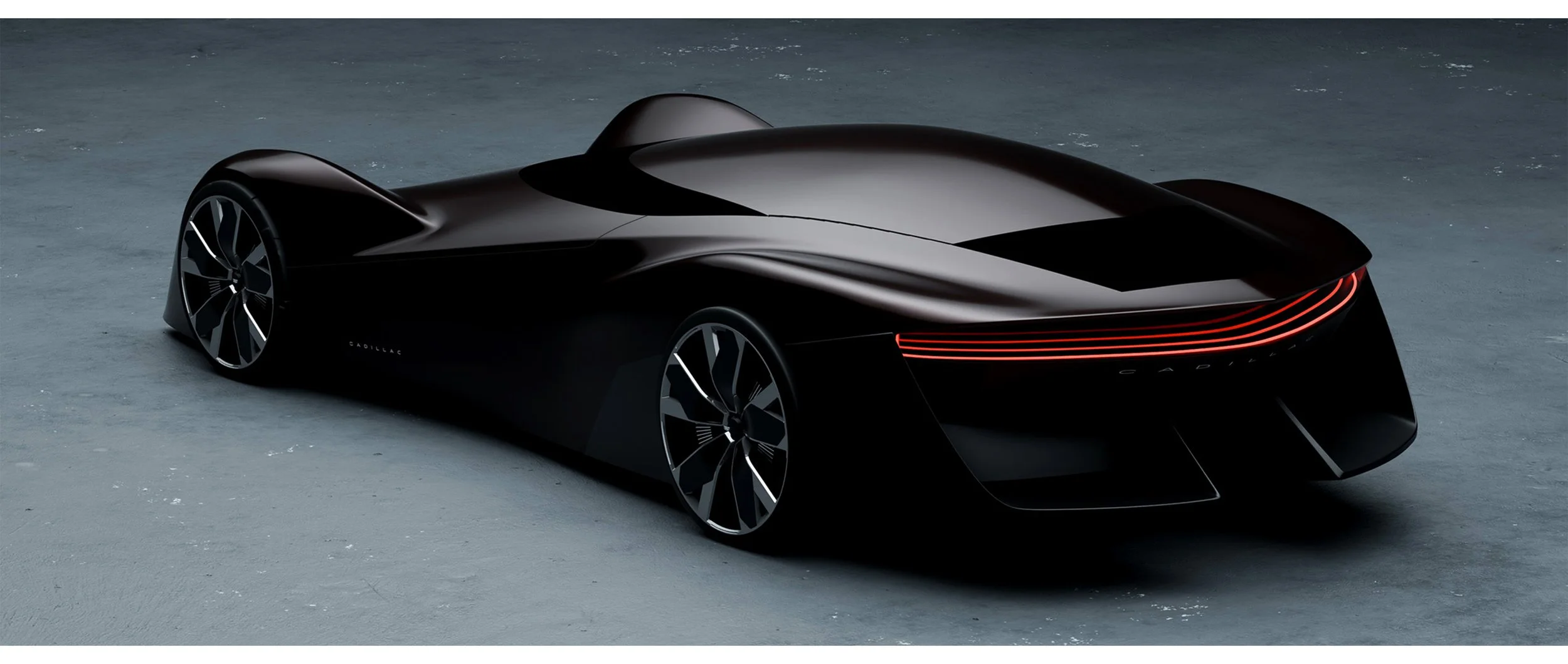 A sleek, black, futuristic concept car with illuminated red taillights, set on a textured gray surface.