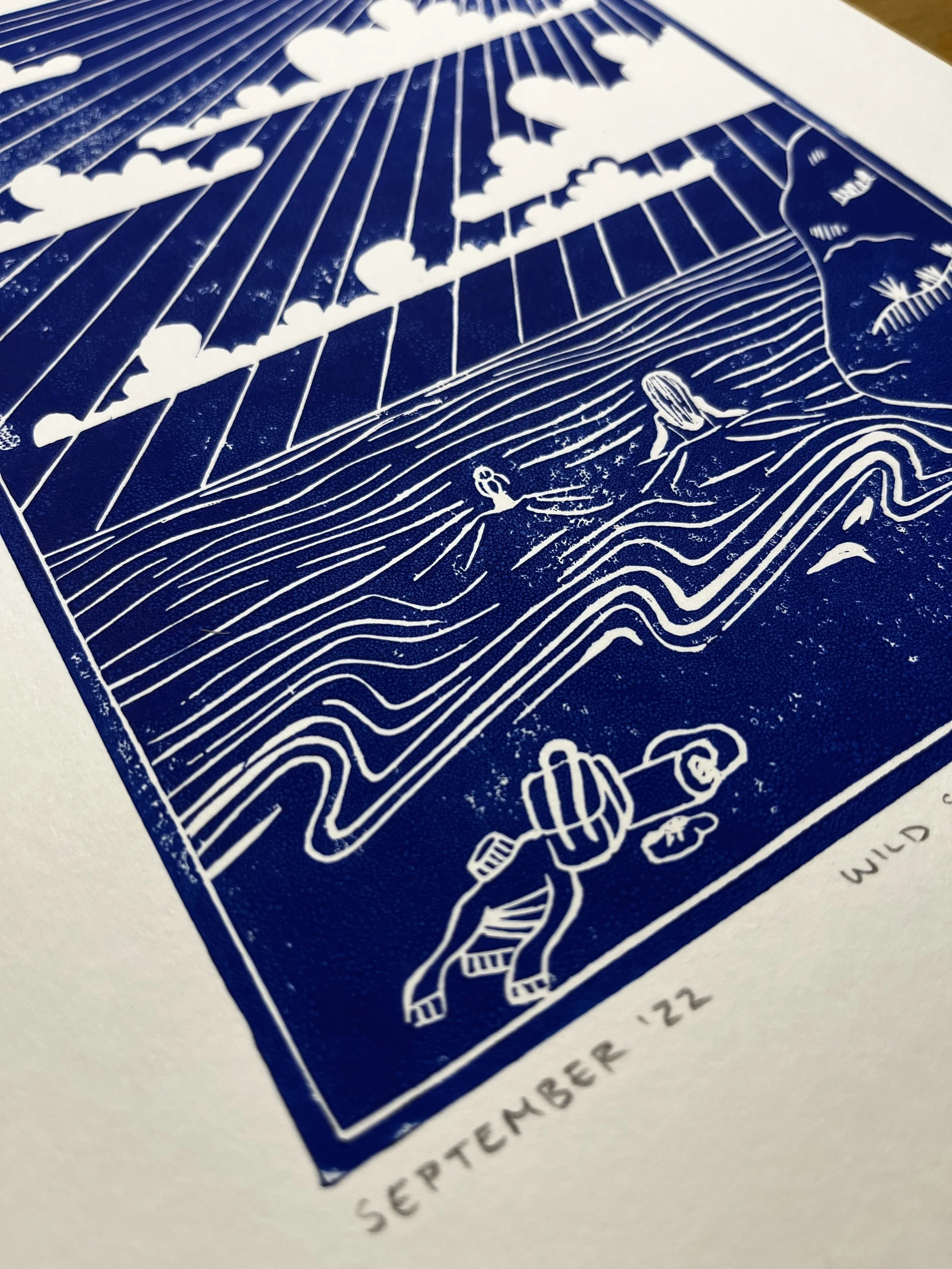 Illustration of a duck swimming in water, with a person kayaking nearby, under a sky with rays and clouds, and a dog walking along a path. The image is labeled 'September '22' and 'Wild'.