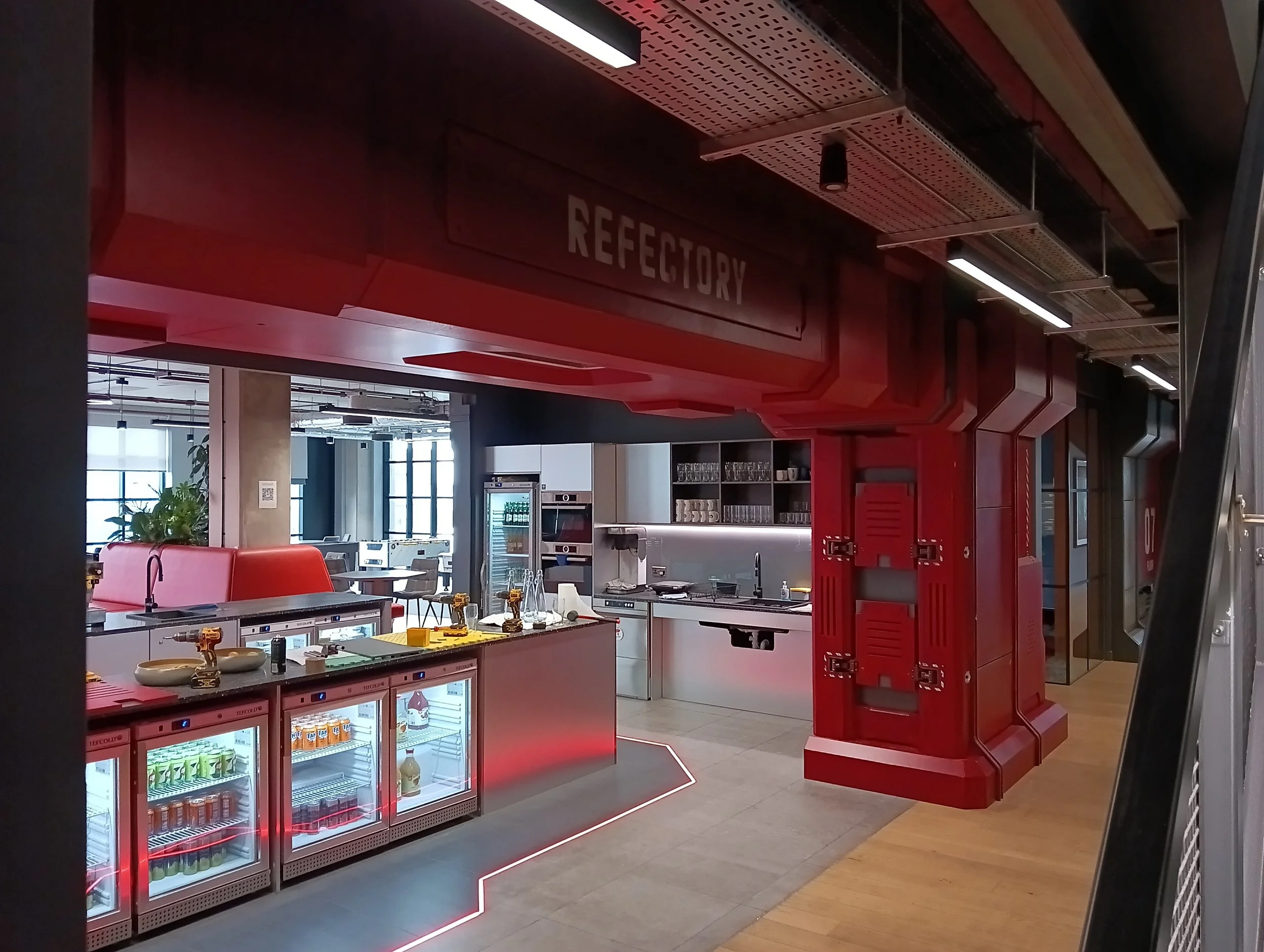 An evolving workplace environment inspired by the Grim Hex location from the client’s game world. Delivered through phased installations to minimise office disruption.