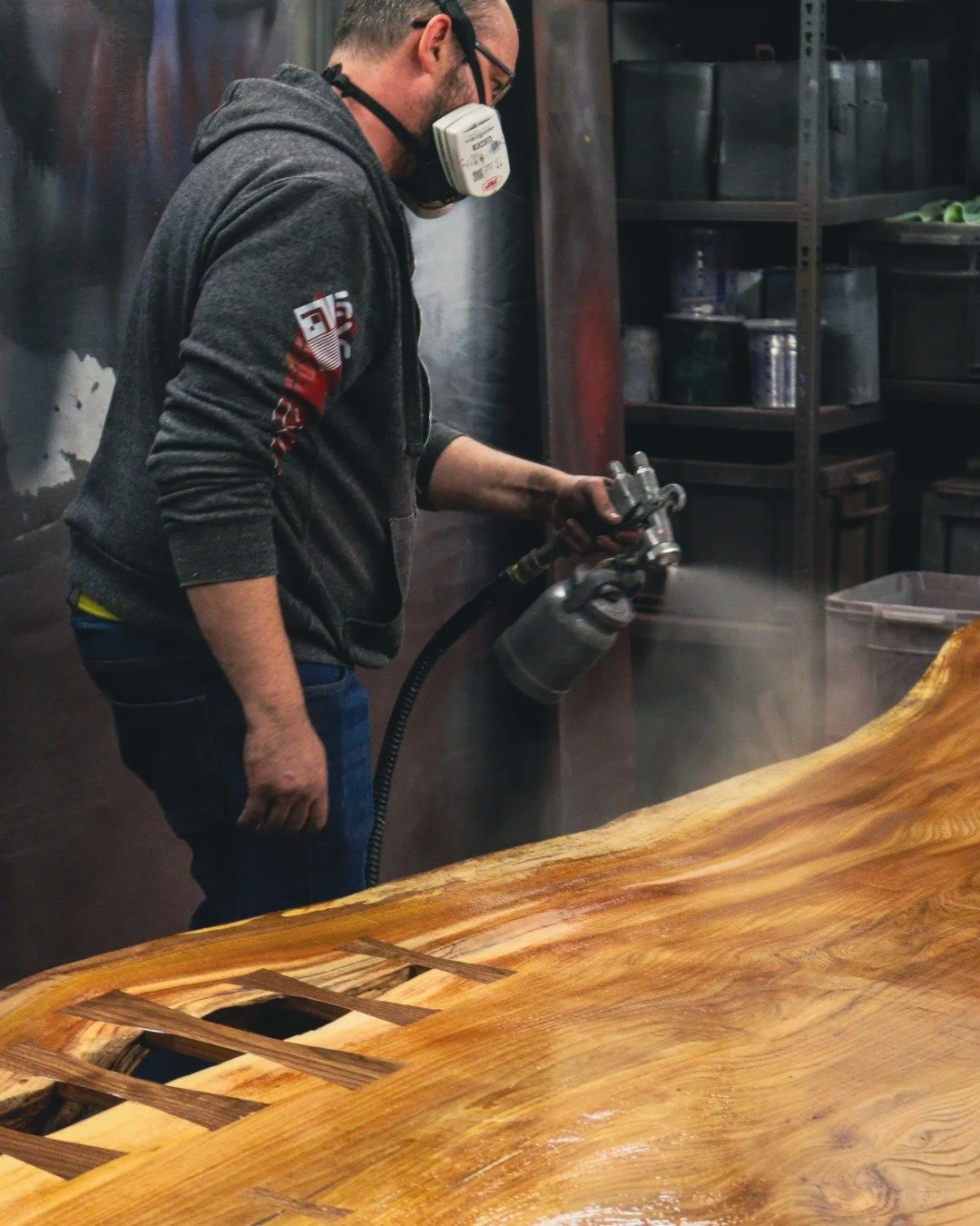 The warehouse came with a spray booth. That wasn't an accident. 

Before JRDF, this space was a mechanics workshop. The spray booth was already here. Professional, automotive-grade, built into the fabric of the building.

It's part of why we moved in