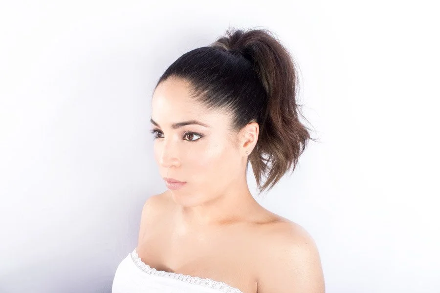 Lima's explosive high ponytail and edgy eyes