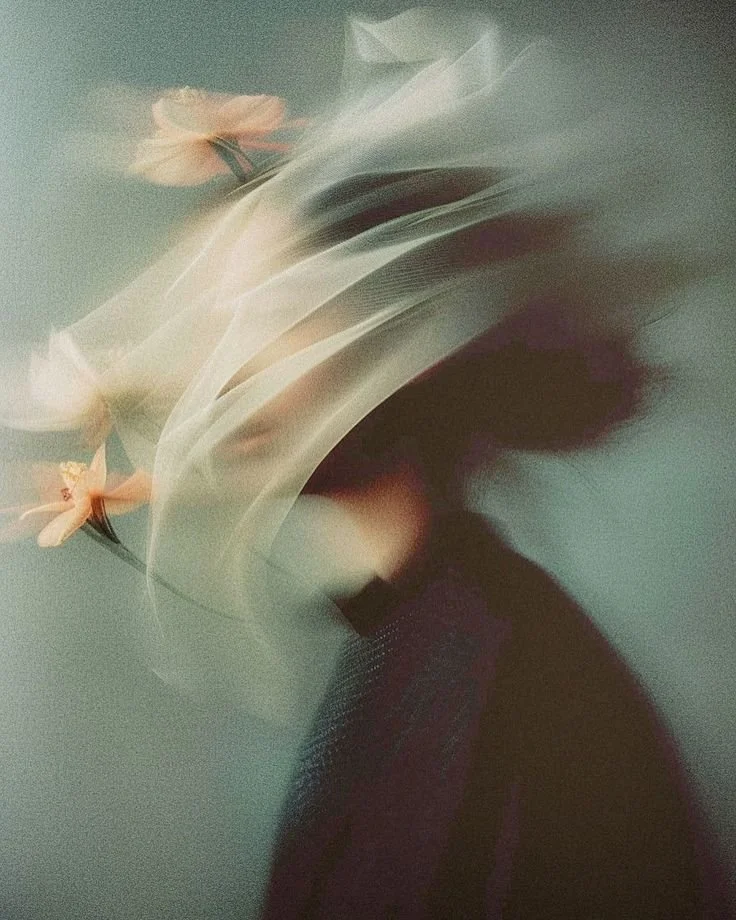 Scenic view of a modern terraced building and garden pathways at sunset in a rural area.