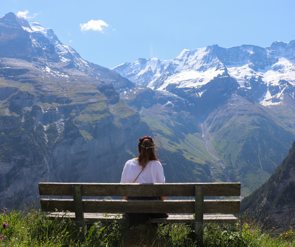 Woman overlooking a mountain landscape, representing hope, healing, and a new perspective after working through anxiety.