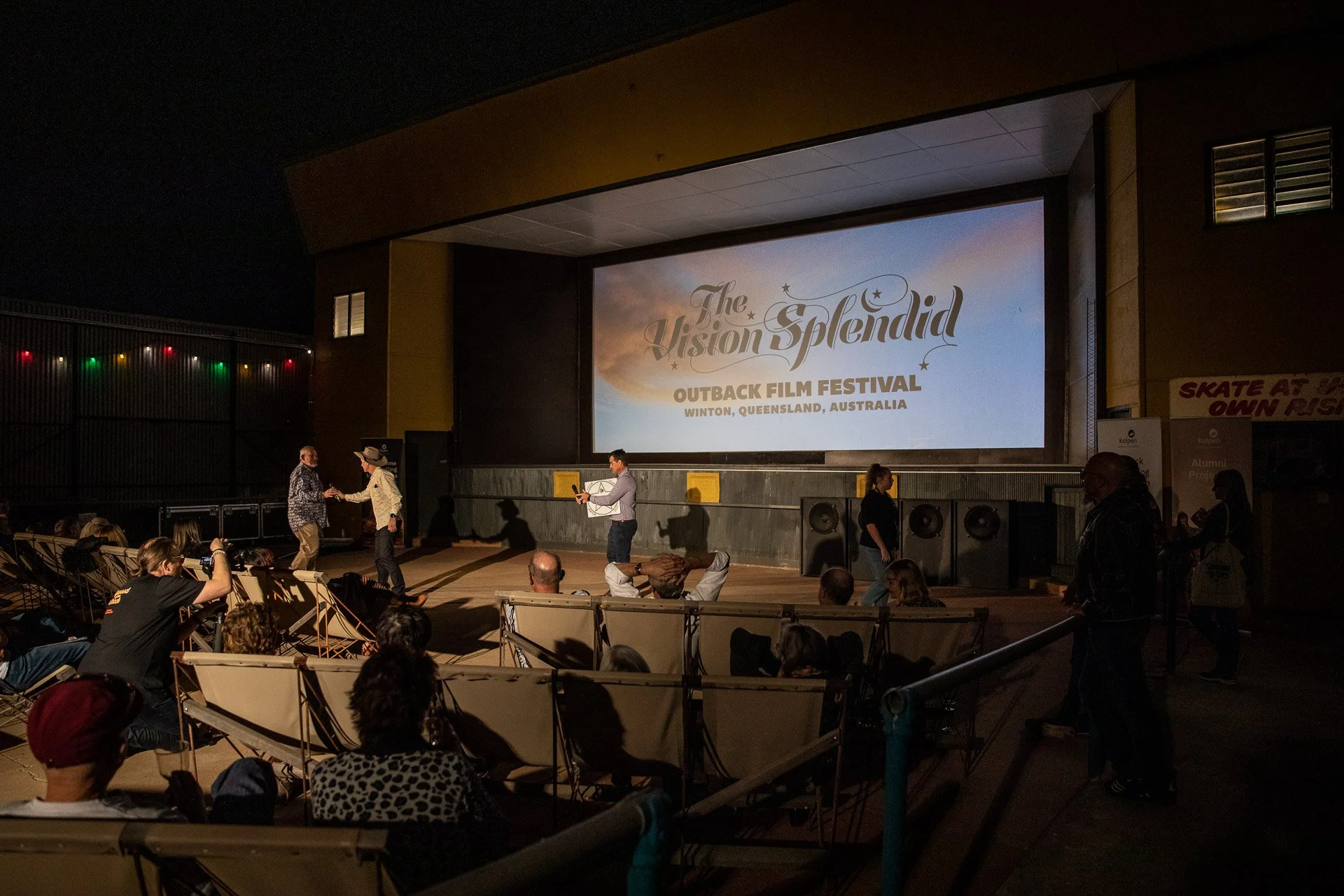 People watching a film screening at The Vision Splendid Outback Film Festival in Winton, Queensland, Australia.