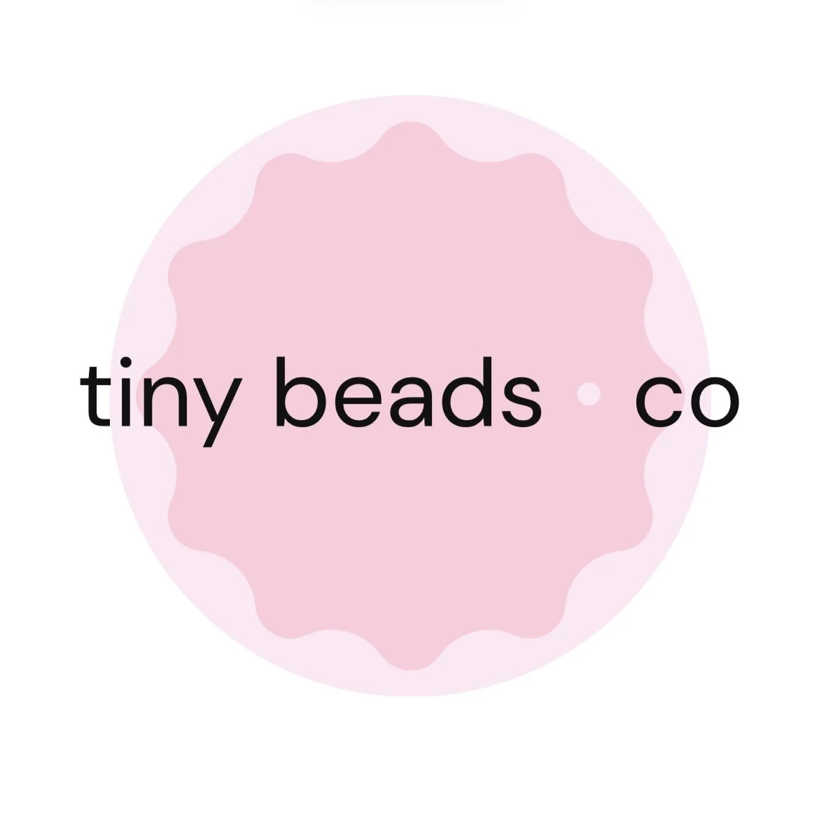 Brand logo with pink circular design and the text "tiny beads co" across the center.