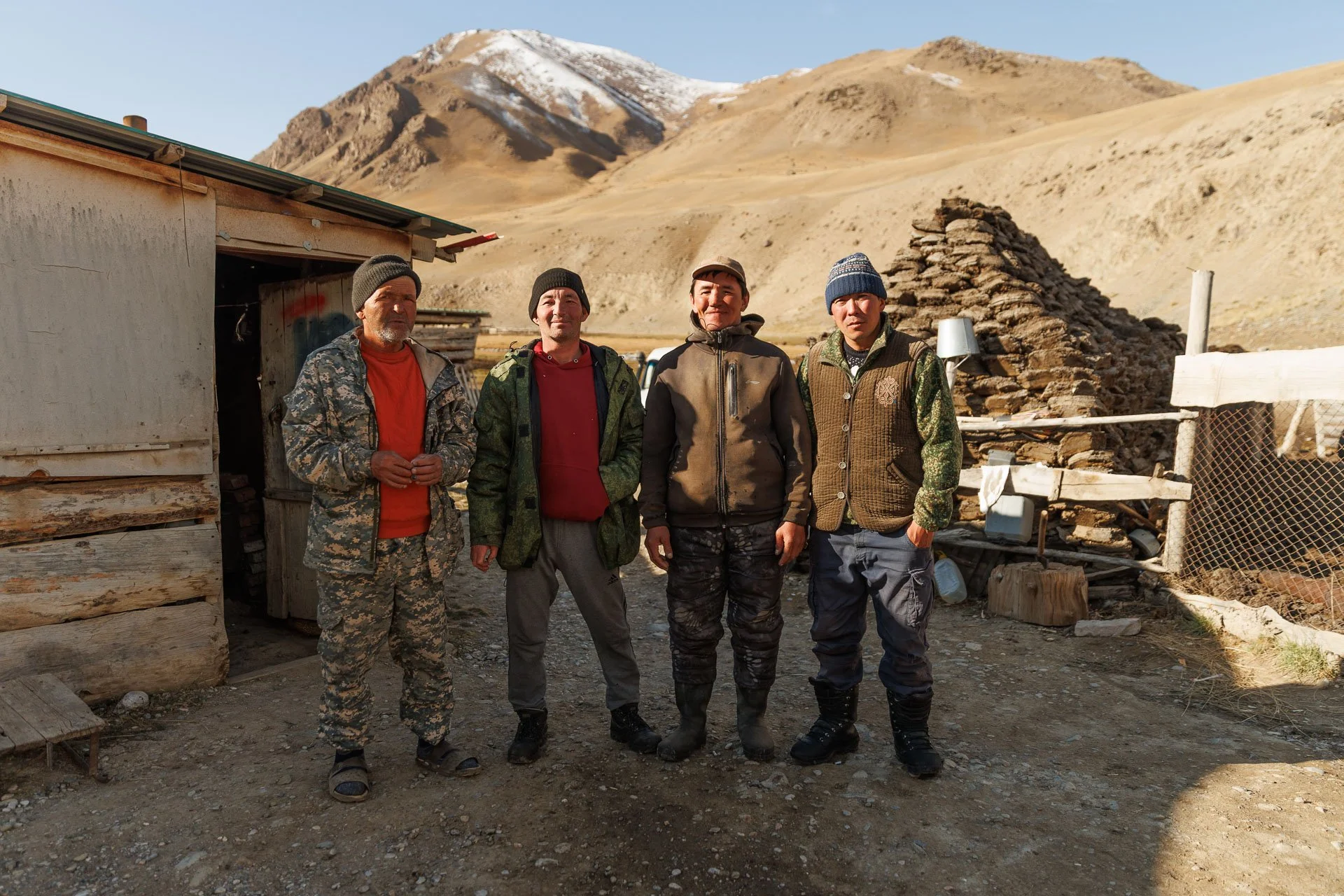 A group of local men in Kyrgyzstan working on a guided tour to track wildlife