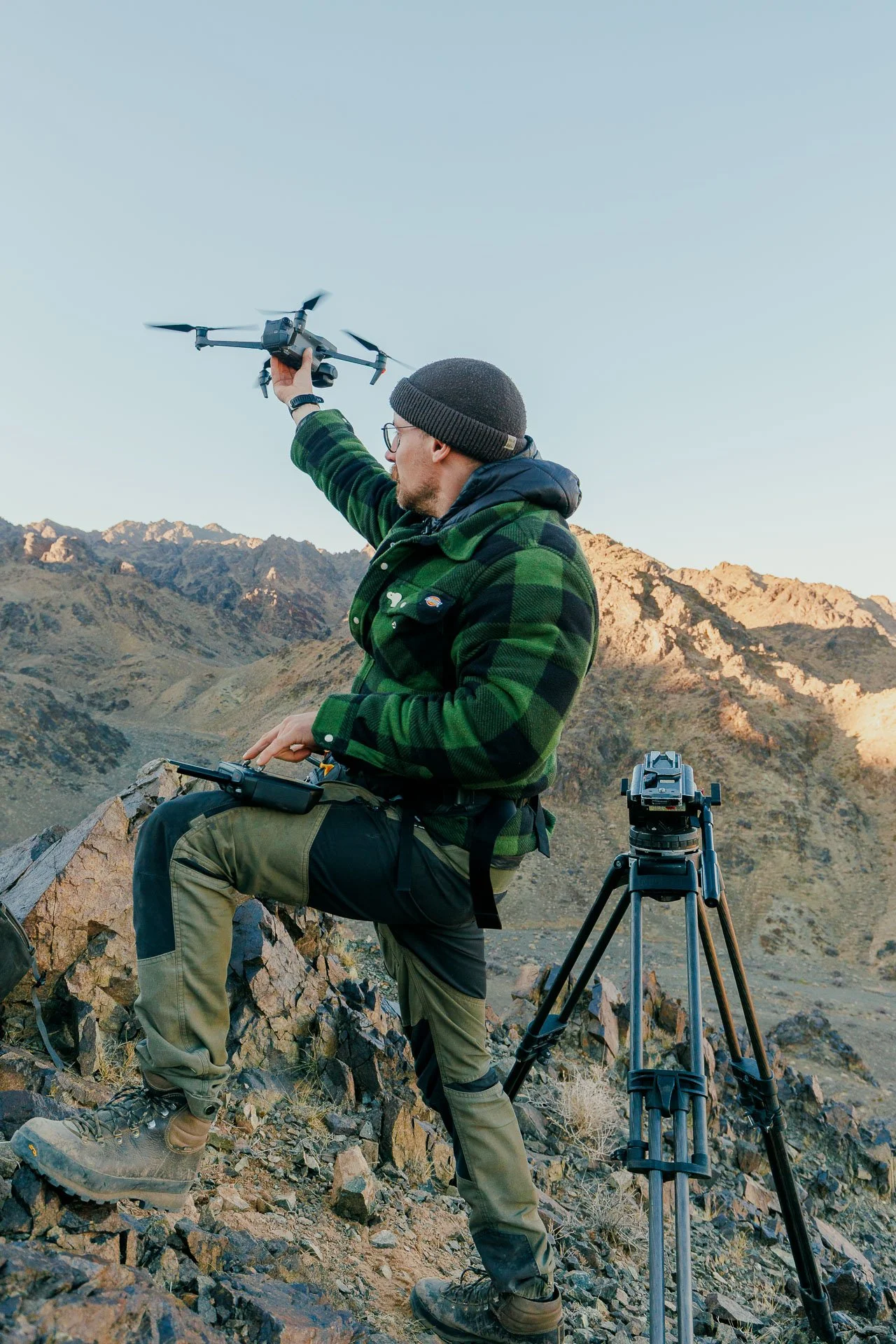A man flying a drone tracking wildlife on a guided tour in Kyrgyzstan