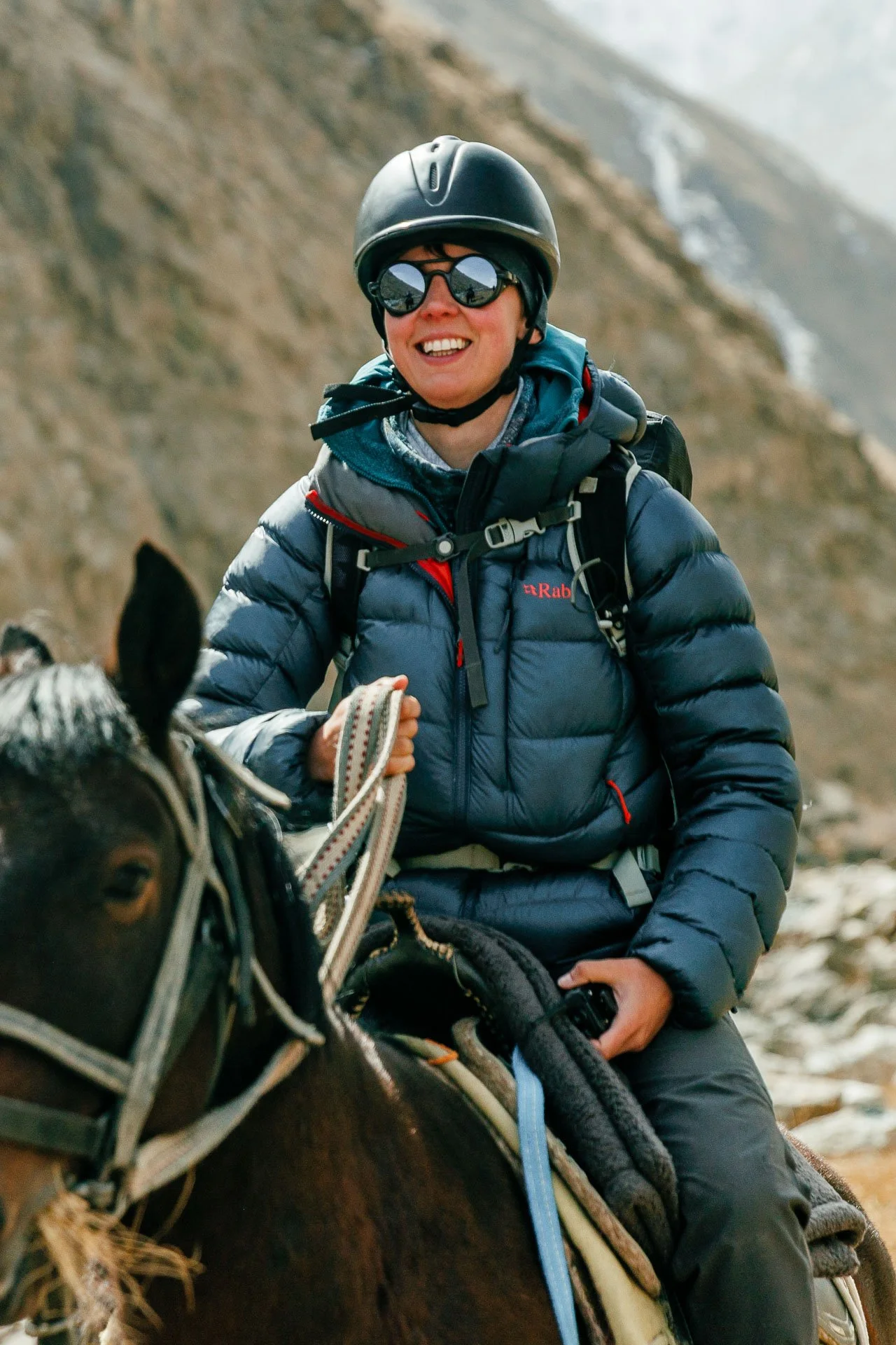 A person riding a horse on a small group tour  in Kyrgyzstan