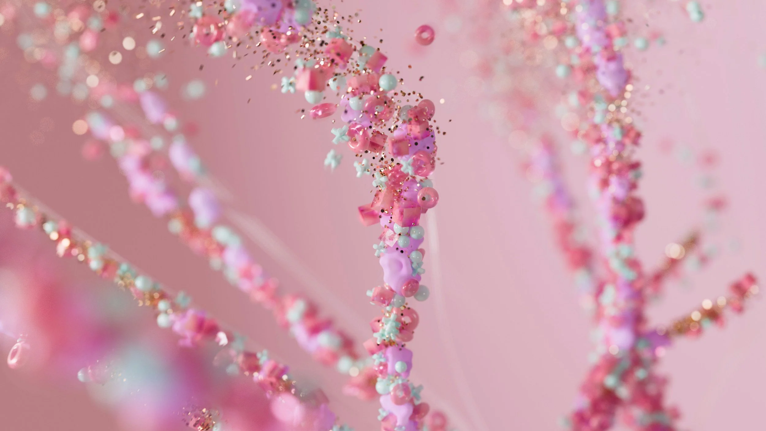 Close-up of pink, white, and pastel-colored tiny beads, glitter, and decorations on a thin wire against a pink background, creating a whimsical, abstract pattern.