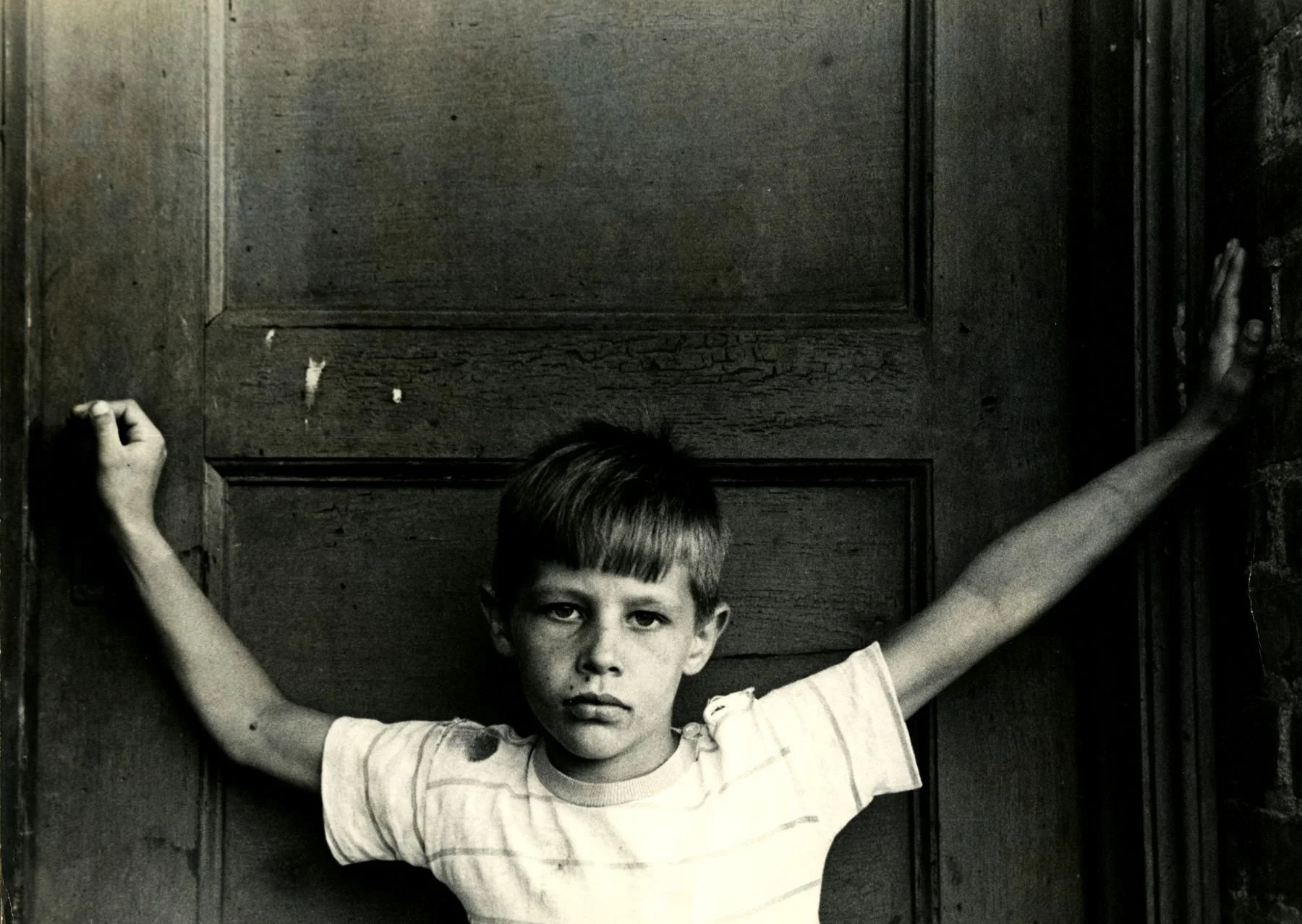 Lenz.GITA_YoungBoy_Doorway_1950s.jpg