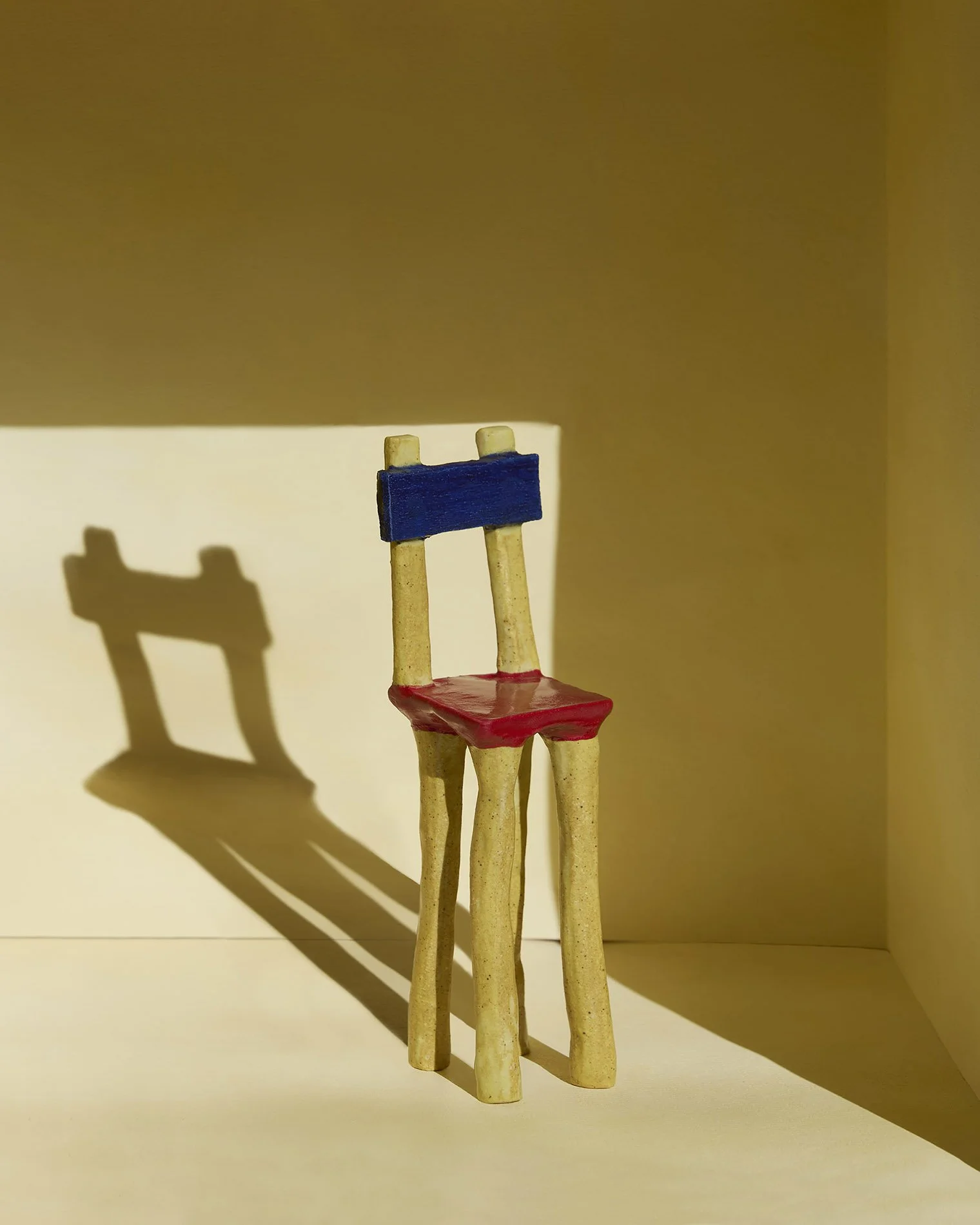 Haser-FourLegs_TallYellowChair.jpg
