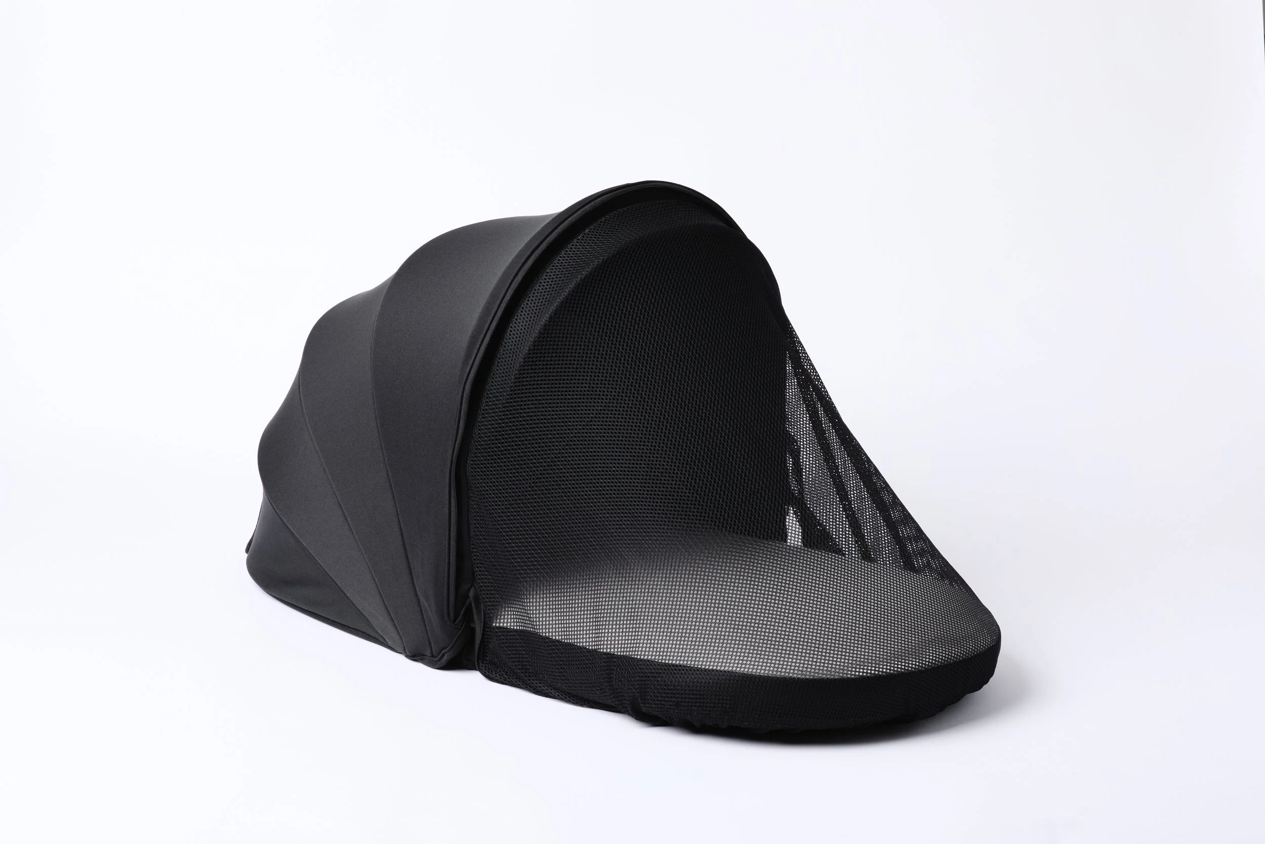 Front view of DayNapper with pull down blackout, insect mesh, designed for newborns.