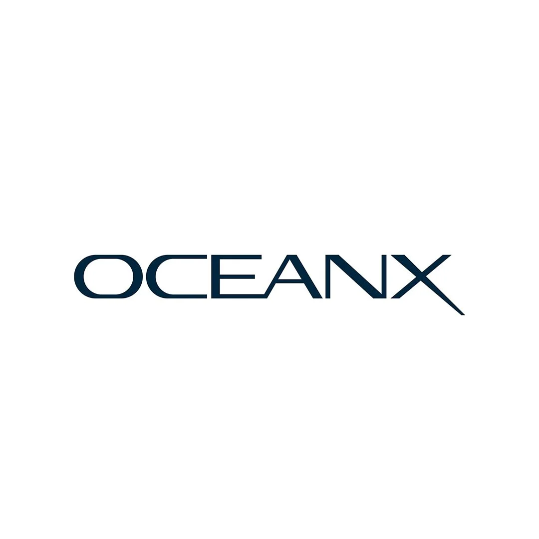 OCEANX logo with navy blue text on a white background.