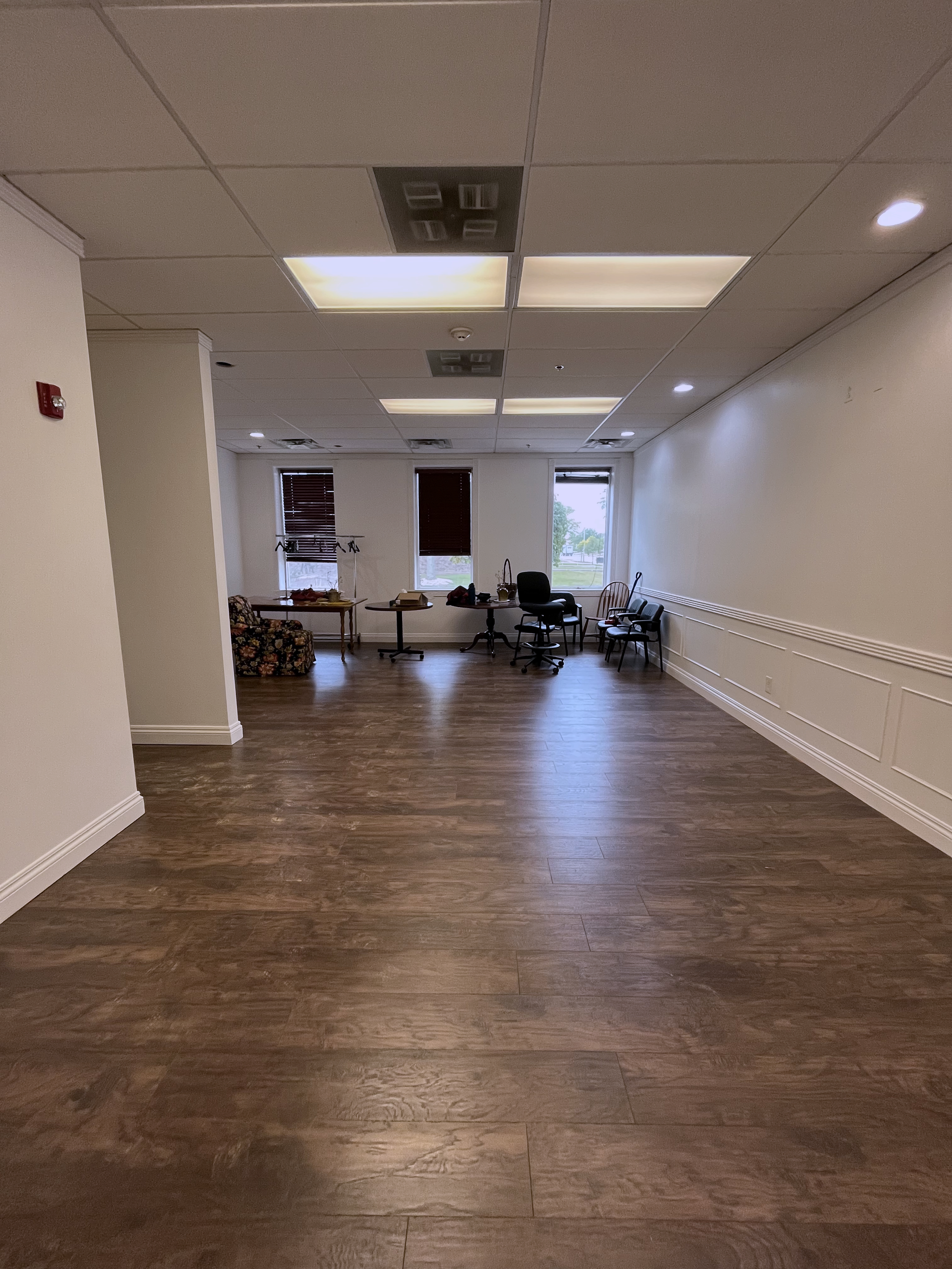 Hardwood floor installed and all trim and baseboards re-painted