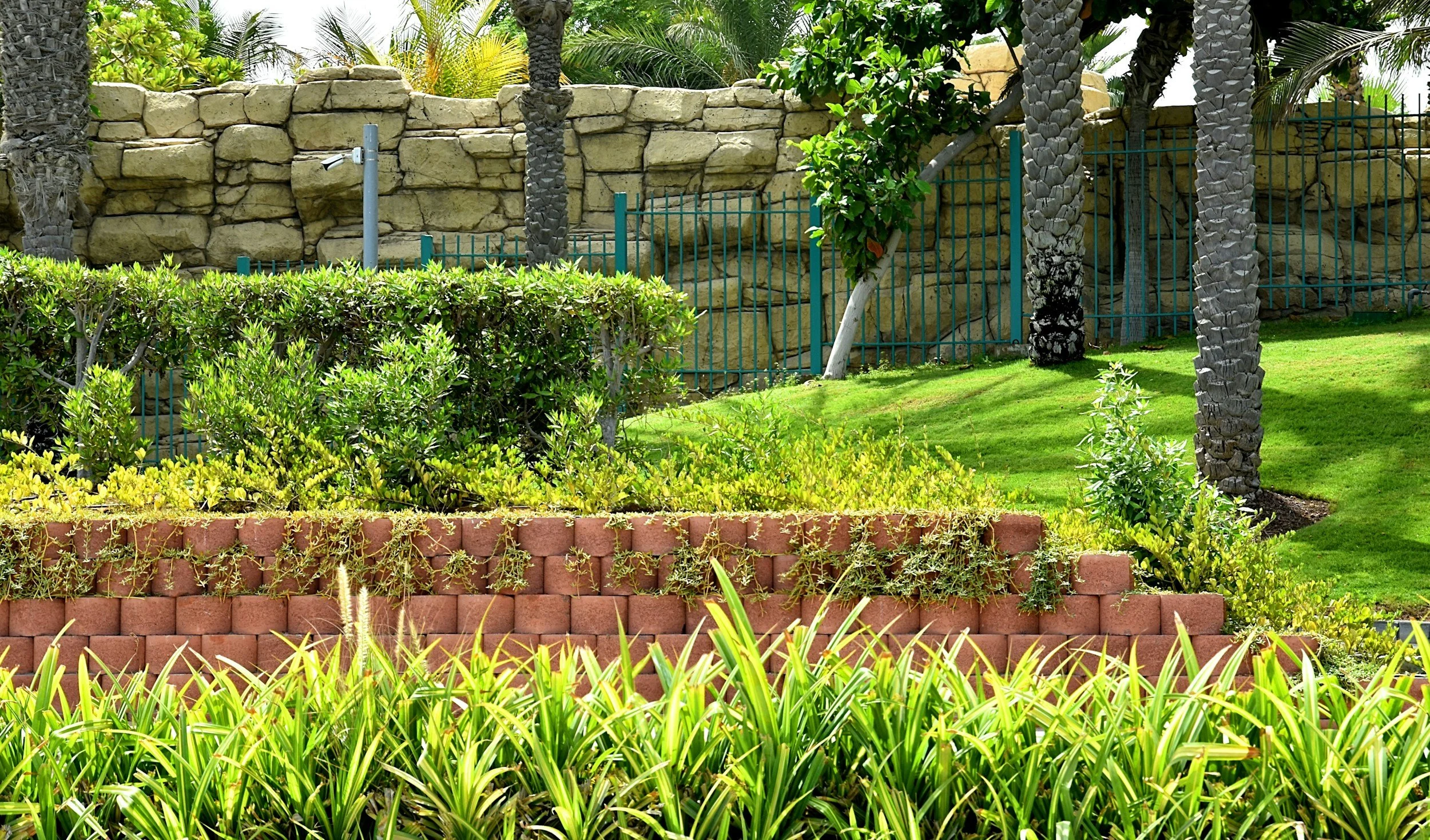 A newly installed retention wall in a residential backyard