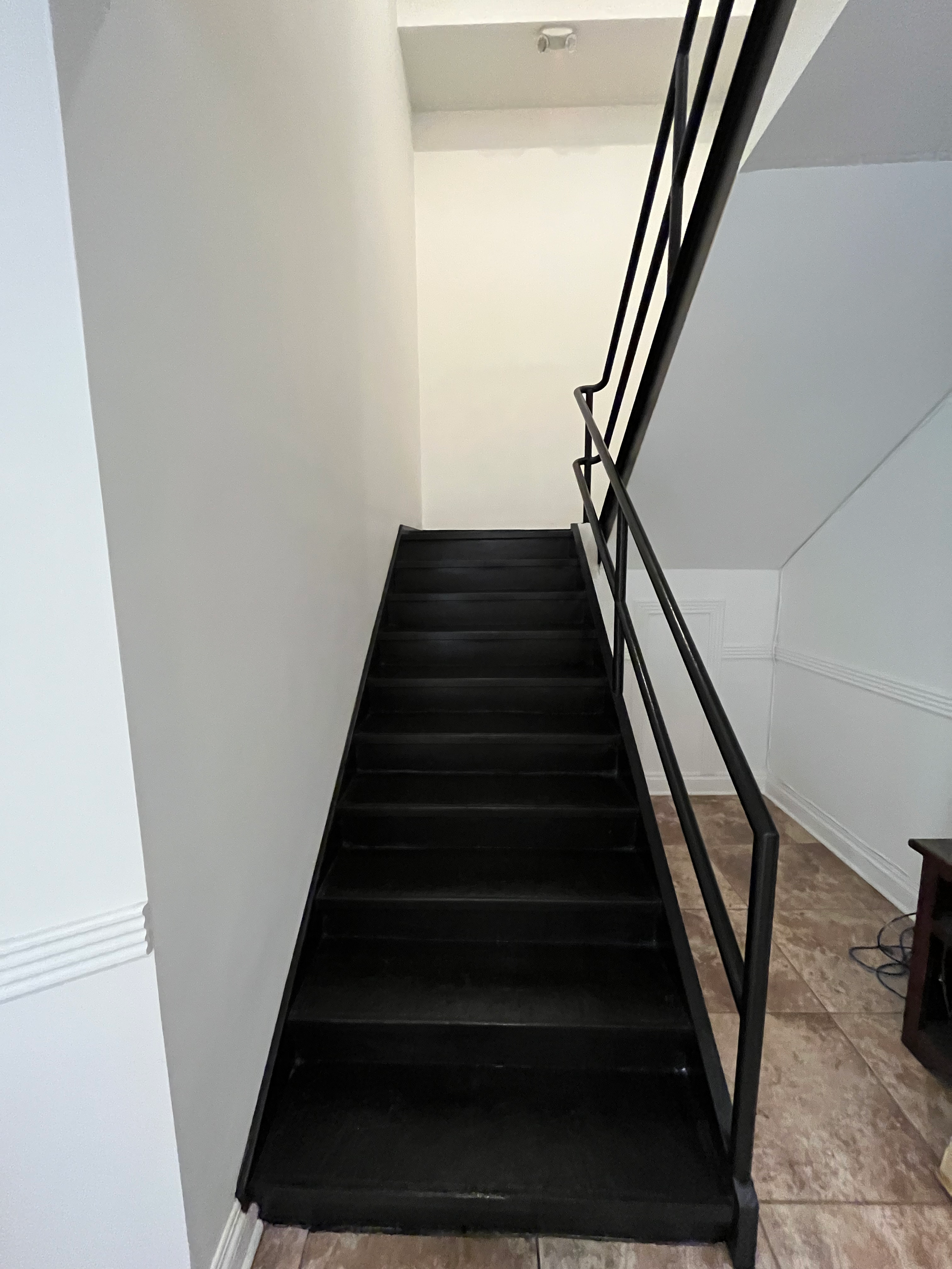 Stair case sanded and painted black
