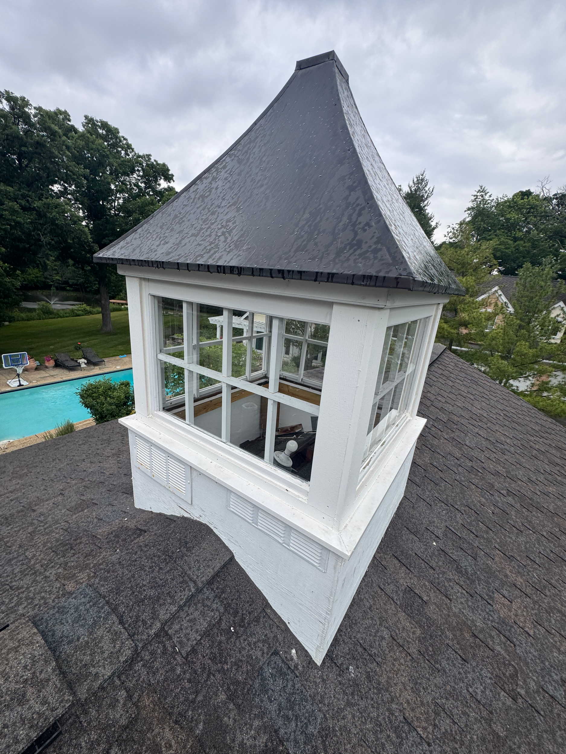 Cupola cleaned and restored with bordering shingles replaced
