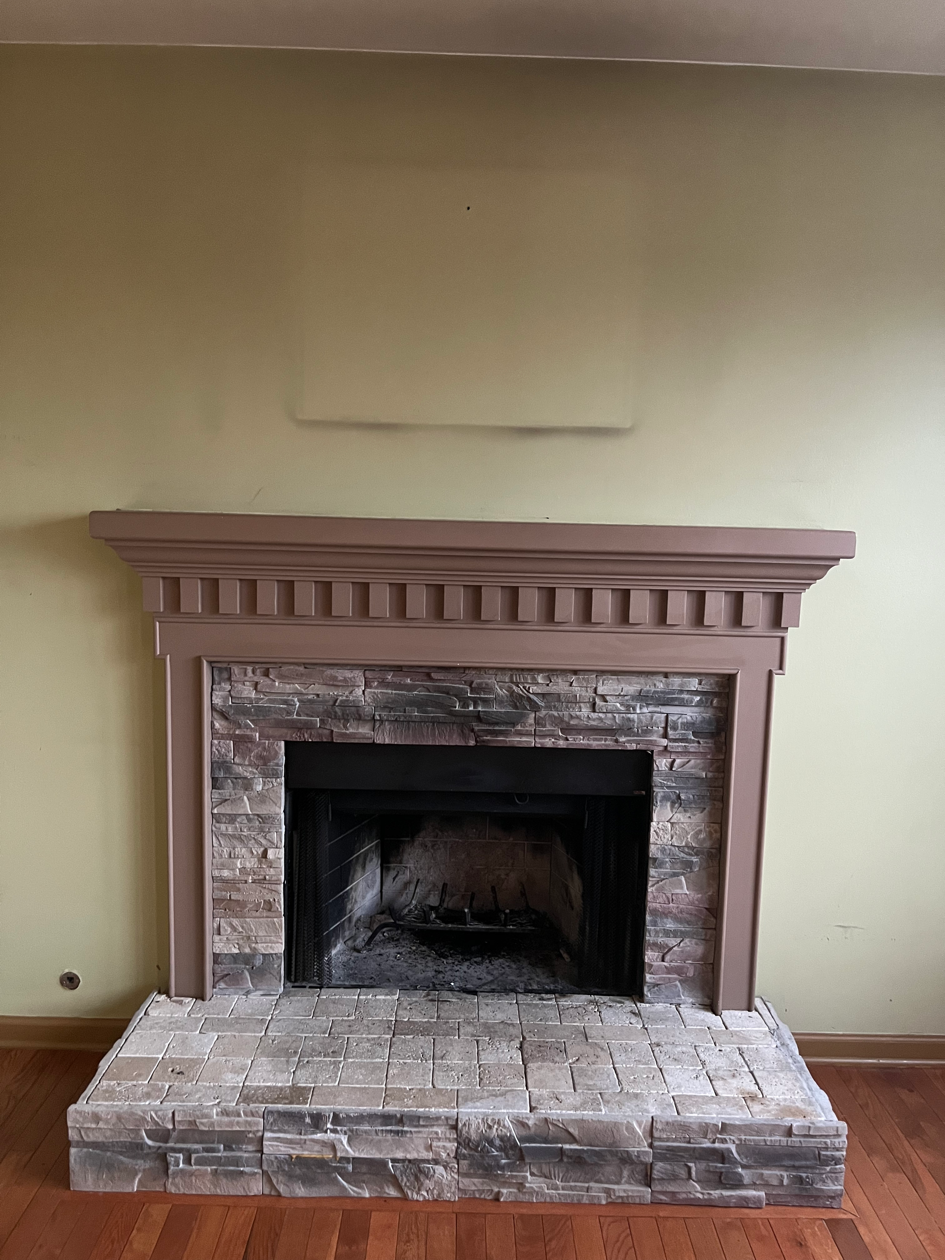 A freshly painted fireplace mantel