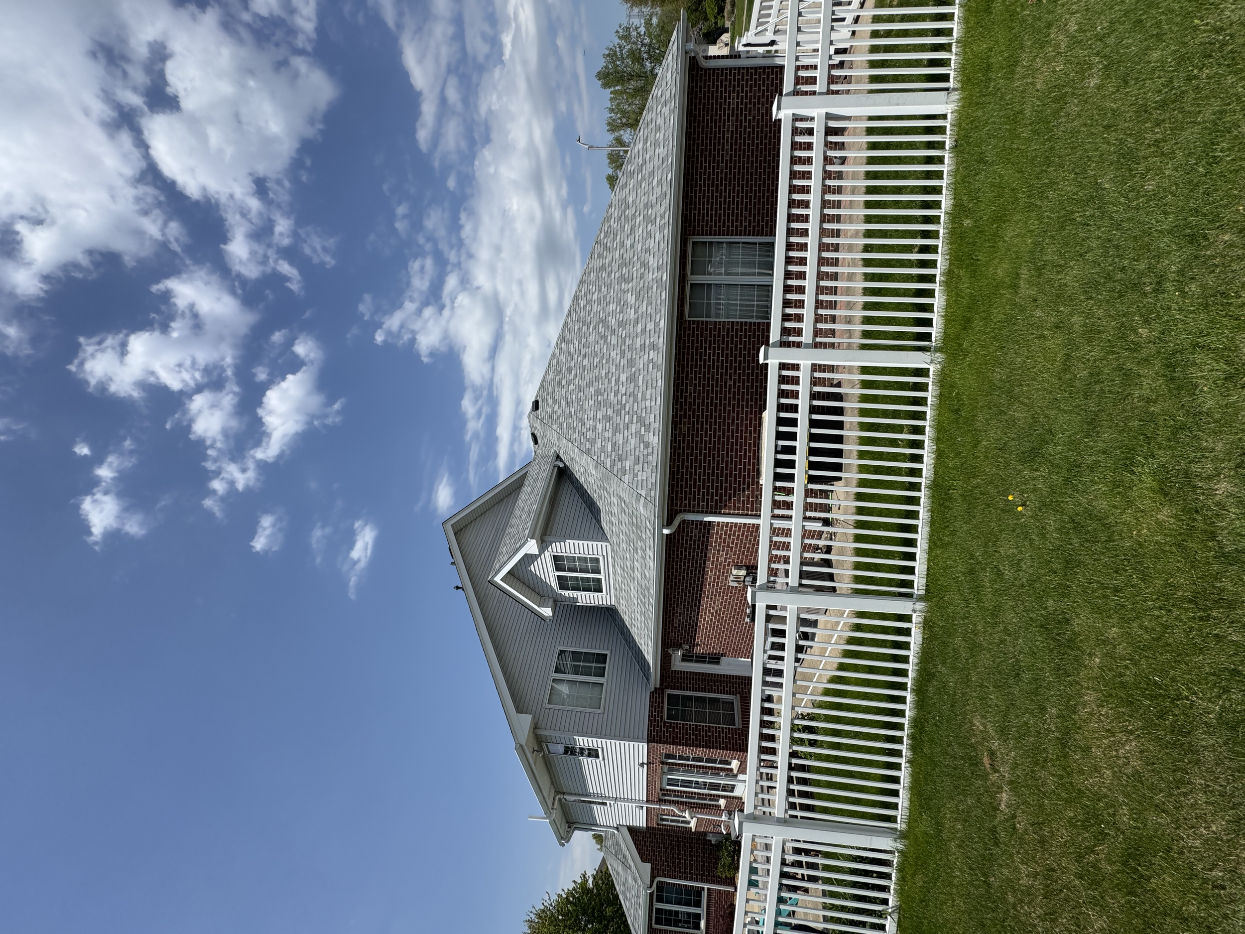 Backyard view of a house with a new fence installed