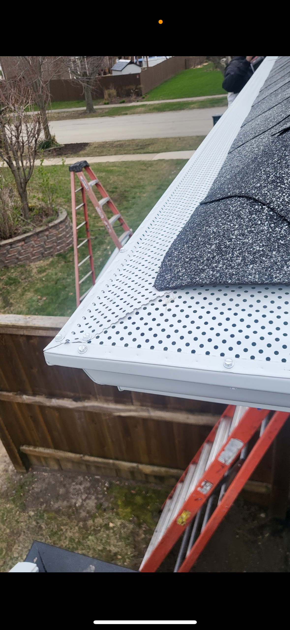 Freshly cleaned gutters with installation of gutter guards