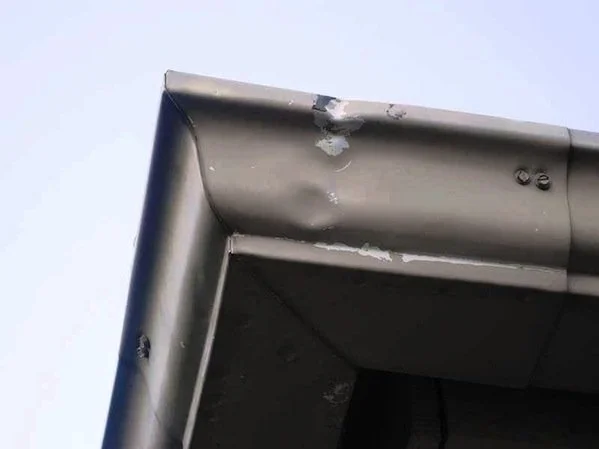 Dented gutters on a residential home