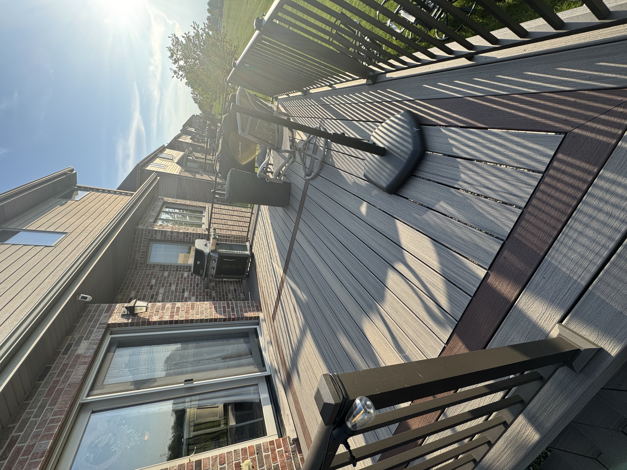 New vinyl deck and railing installation at a residential property