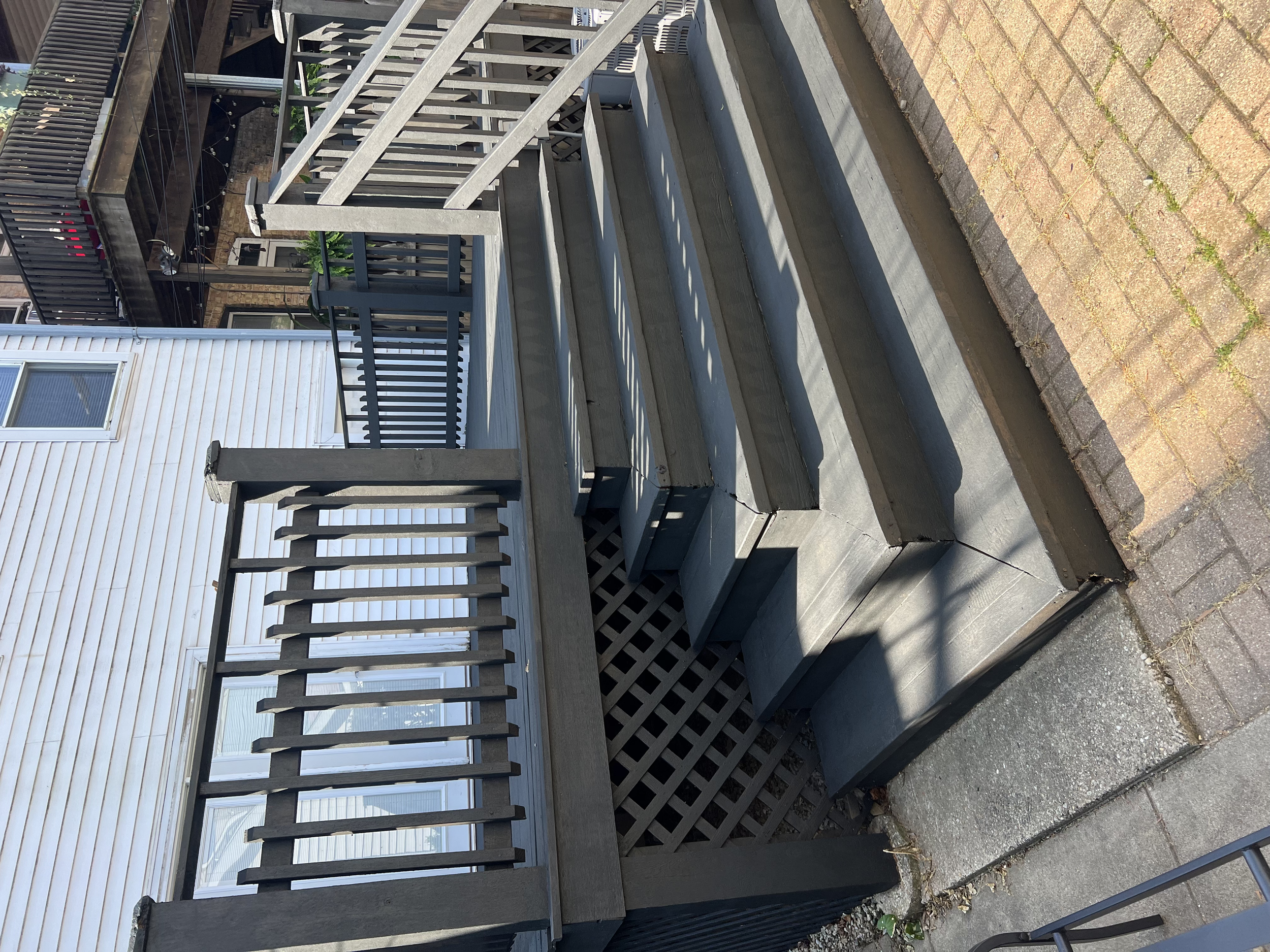 Deck staircase after patching all wood and professional sanding and staining