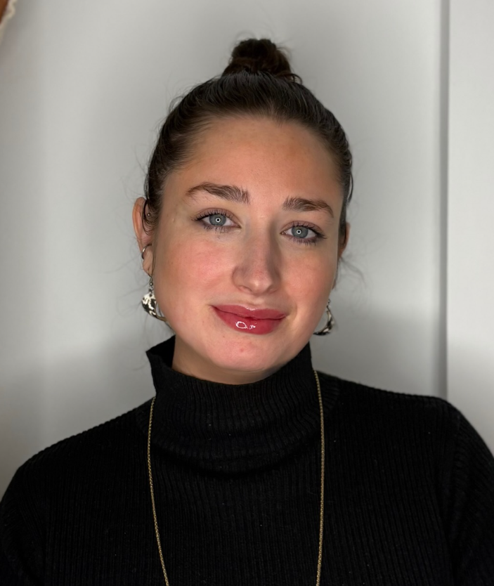 Client showcasing healed lip blush results with an even, natural tint and a glossy finish