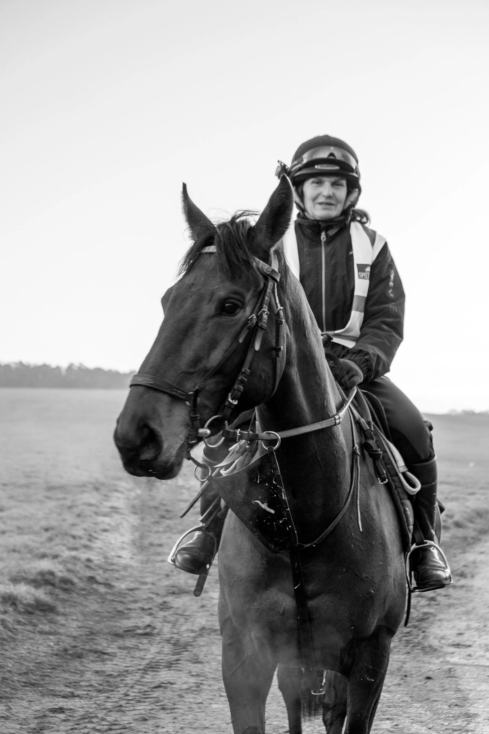 A person riding a horse outdoors during daytime.
