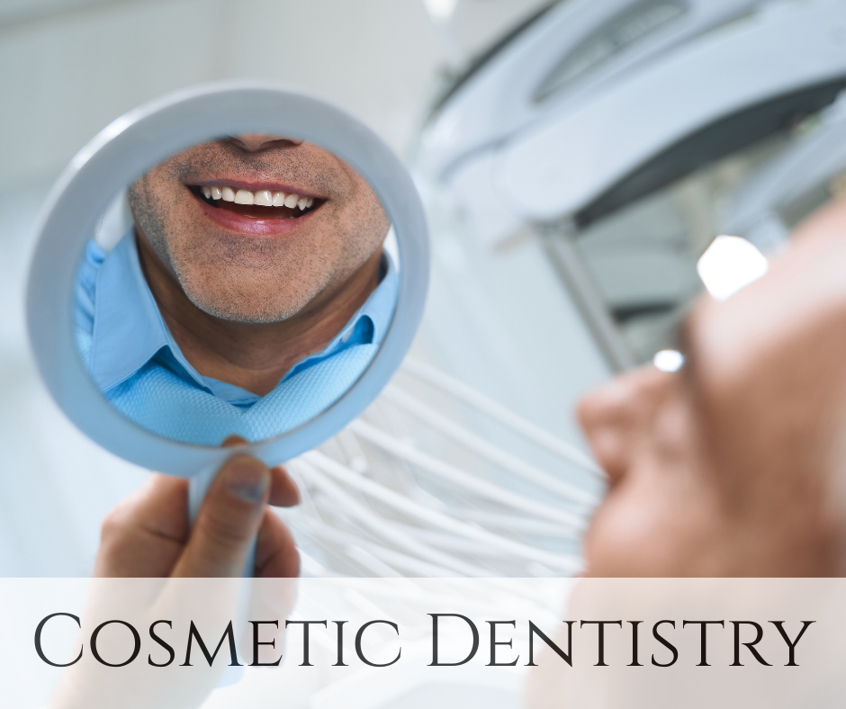 Close-up of a man looking at his teeth while holding a mirror, with the reflection showing a big smile in a dental clinic.