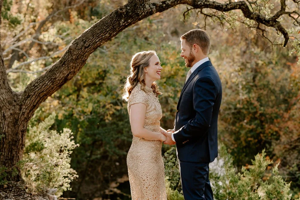 Engaged couple holding hands during a nature engagement session near Seattle, photographed in soft natural light
