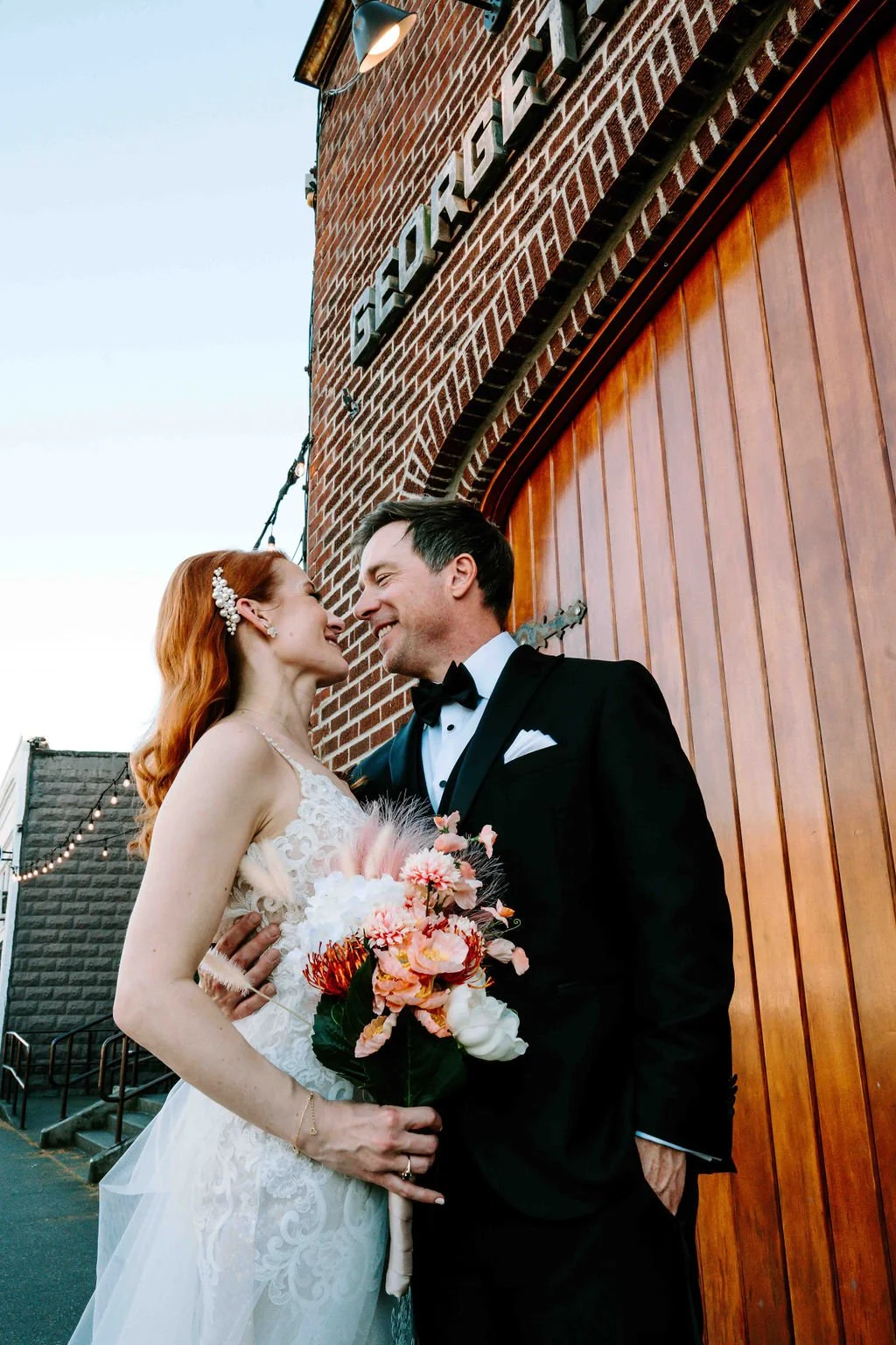Editorial wedding portrait of a couple at a brick Seattle wedding venue with modern, timeless styling
