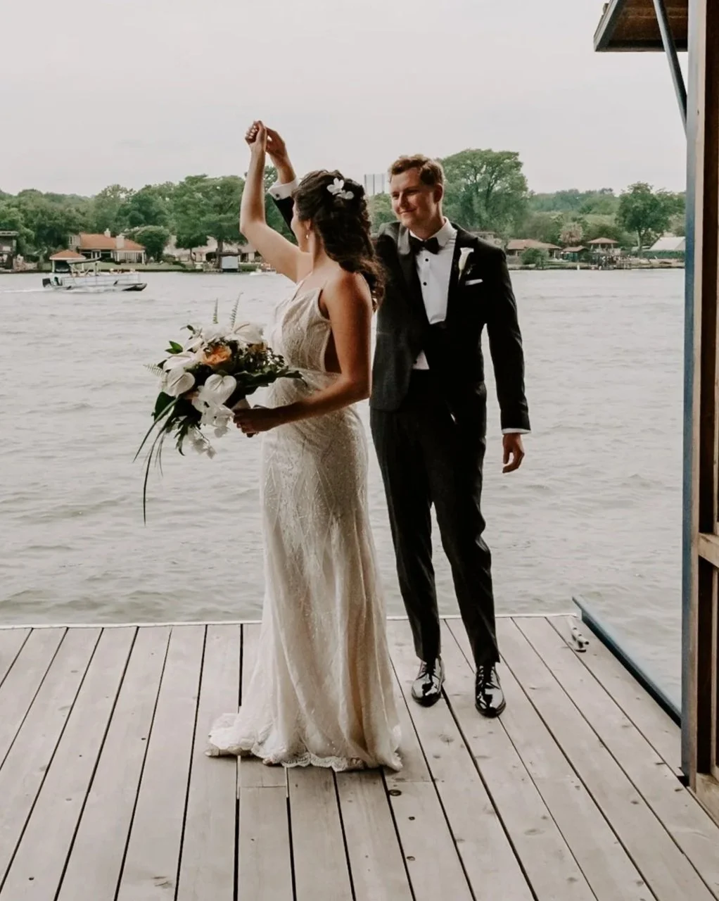 Candid waterfront wedding moment in Seattle photographed by a documentary-style wedding photographer.