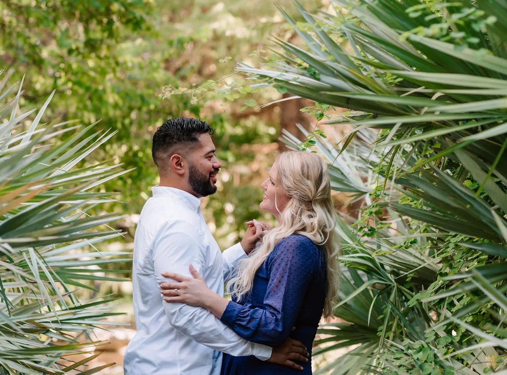 Engaged couple sharing a quiet moment in a garden setting near Seattle, photographed in natural light