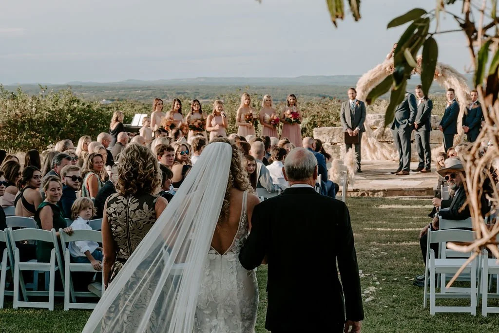 Newly married couple walking together after an outdoor wedding ceremony, captured in a natural and editorial style in Seattle