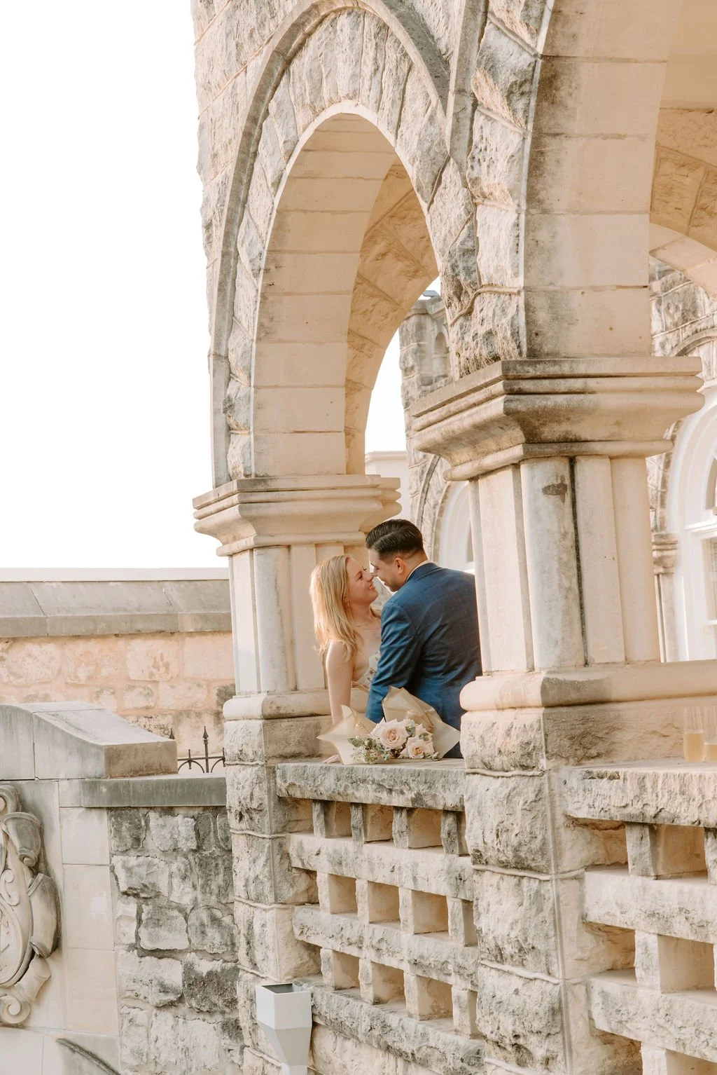 Marriage proposal photographed at a chateau-style venue in Bellevue, Washington, featuring an intimate couple moment
