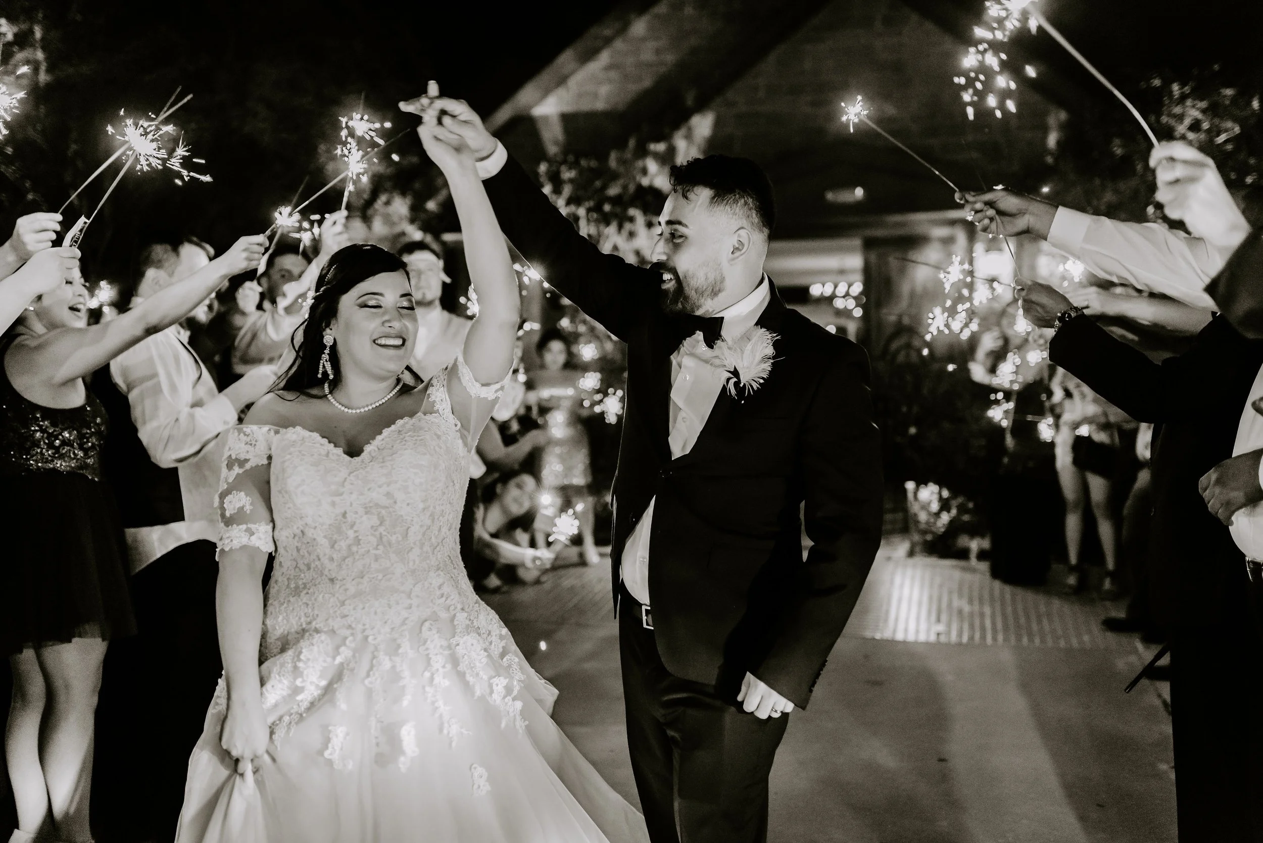 Candid sparkler exit celebration photographed at a Seattle wedding in a documentary style.